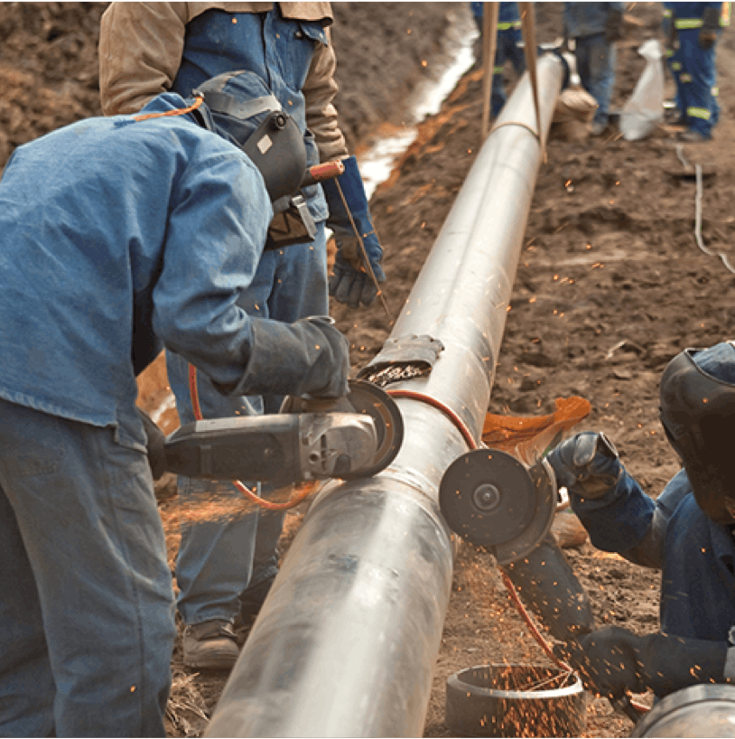 Midstream pipeline workers repair an oil & gas pipeline.