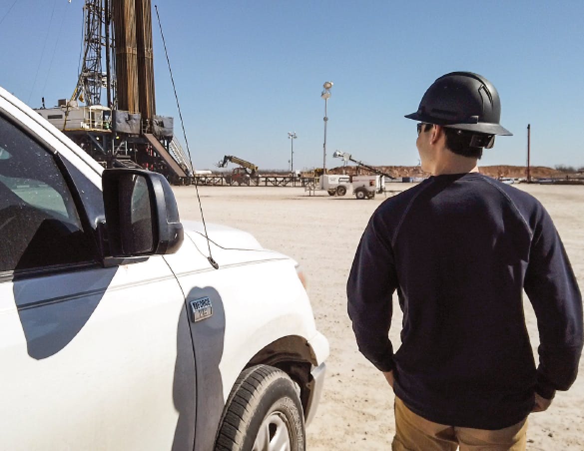 A contractor arrives a an upstream drilling site.