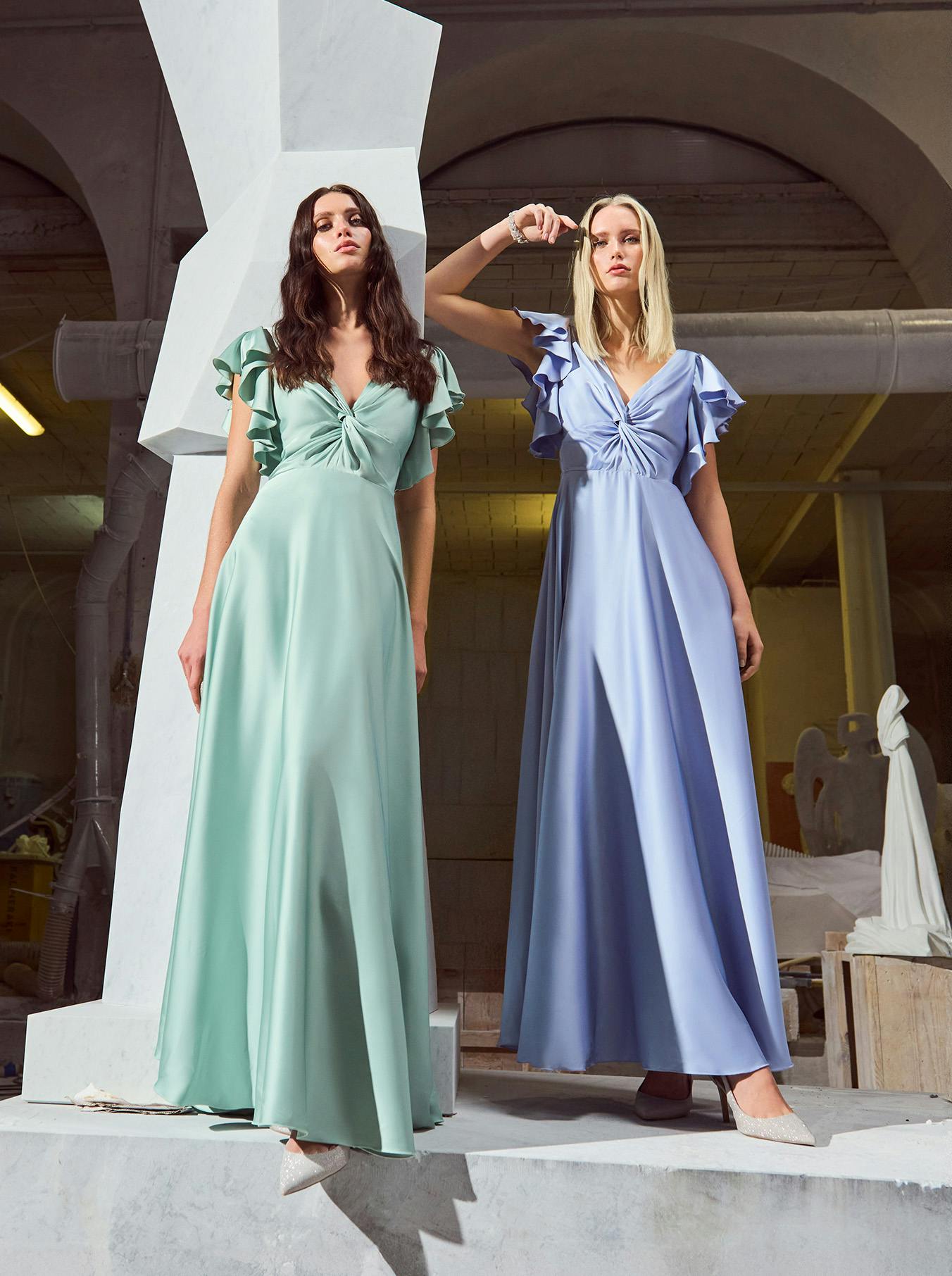 Two women in elegant dresses