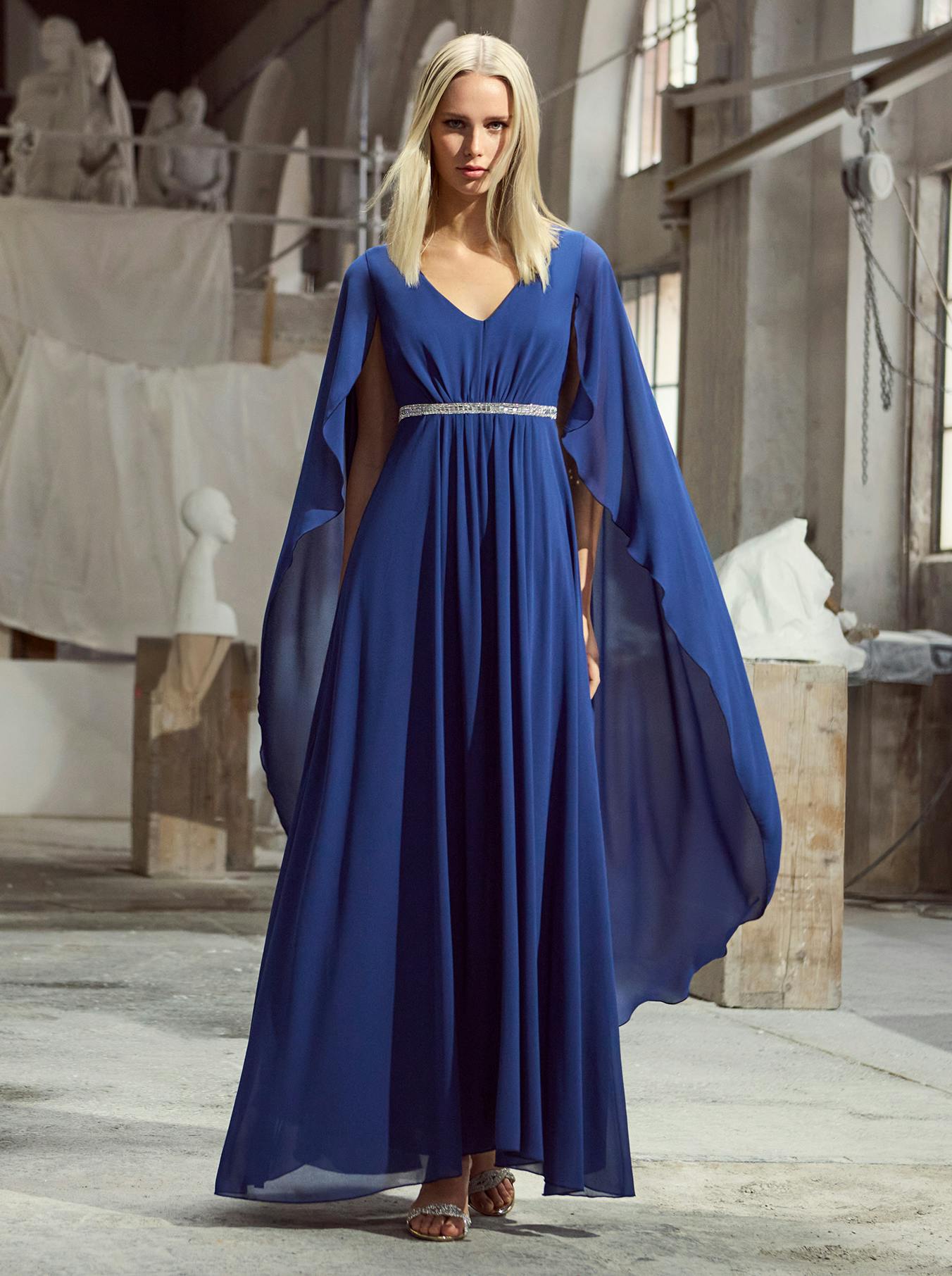 A woman wearing a blue ceremony dress