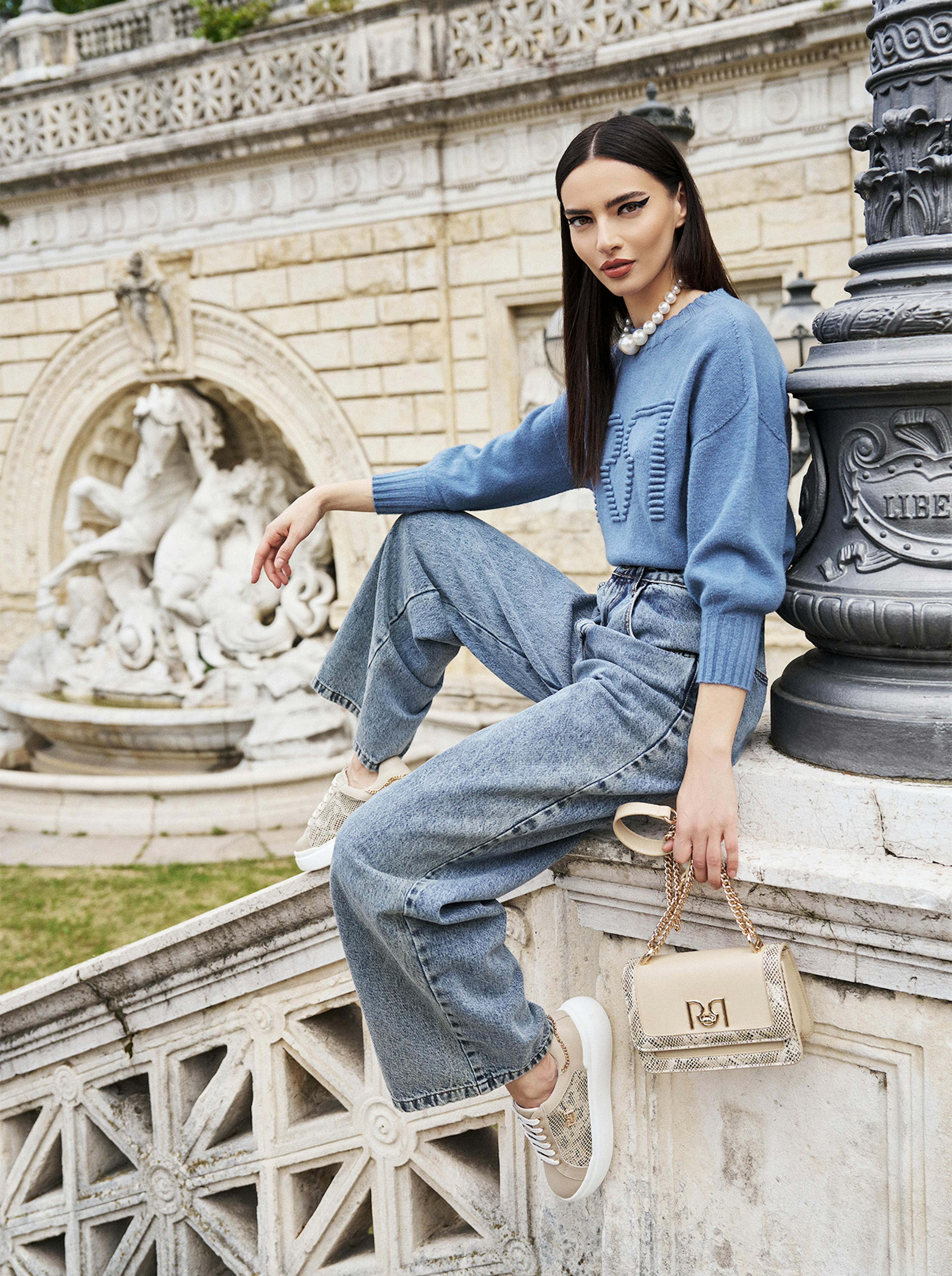 Model with light blue jumper