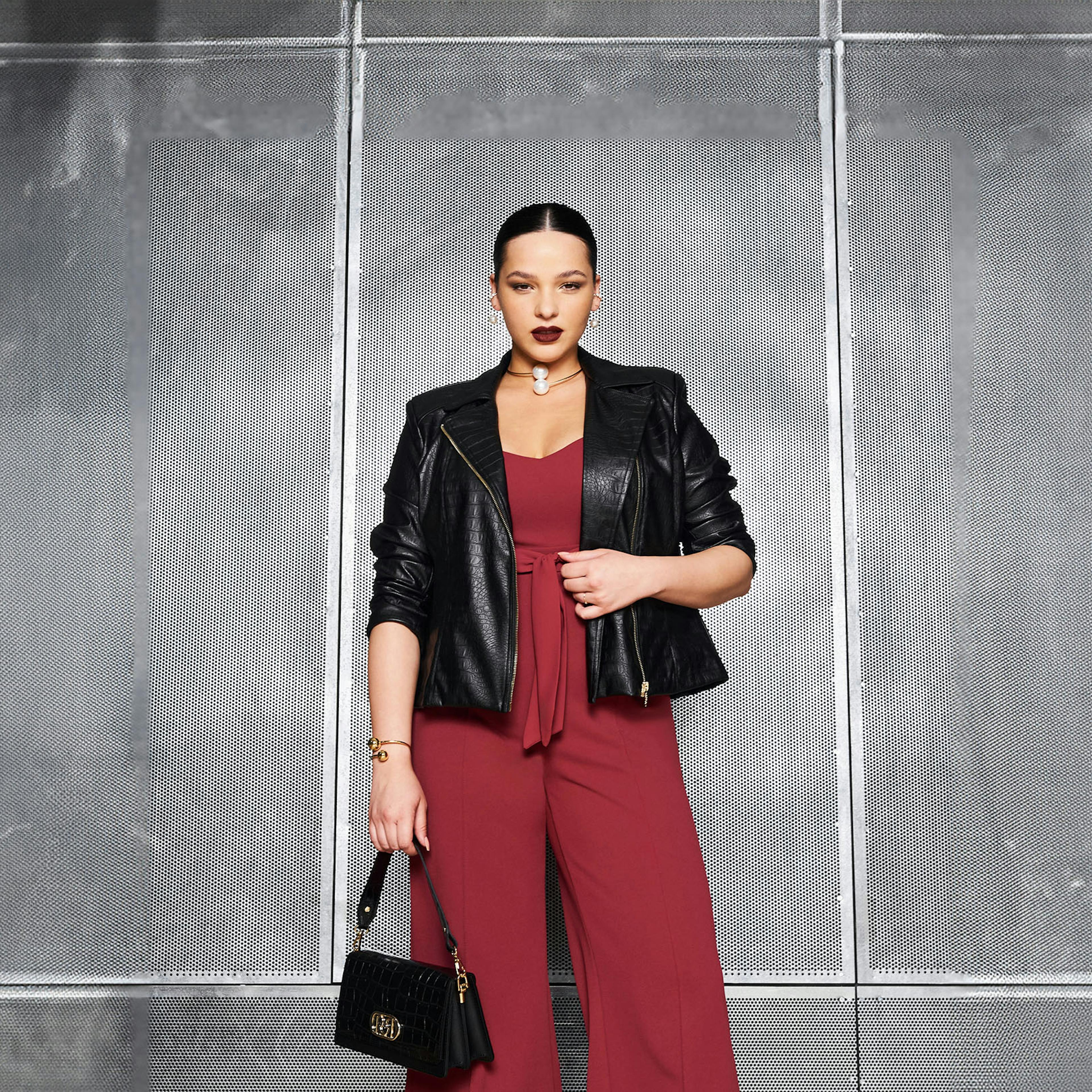 Curvy model with burgundy jumpsuit