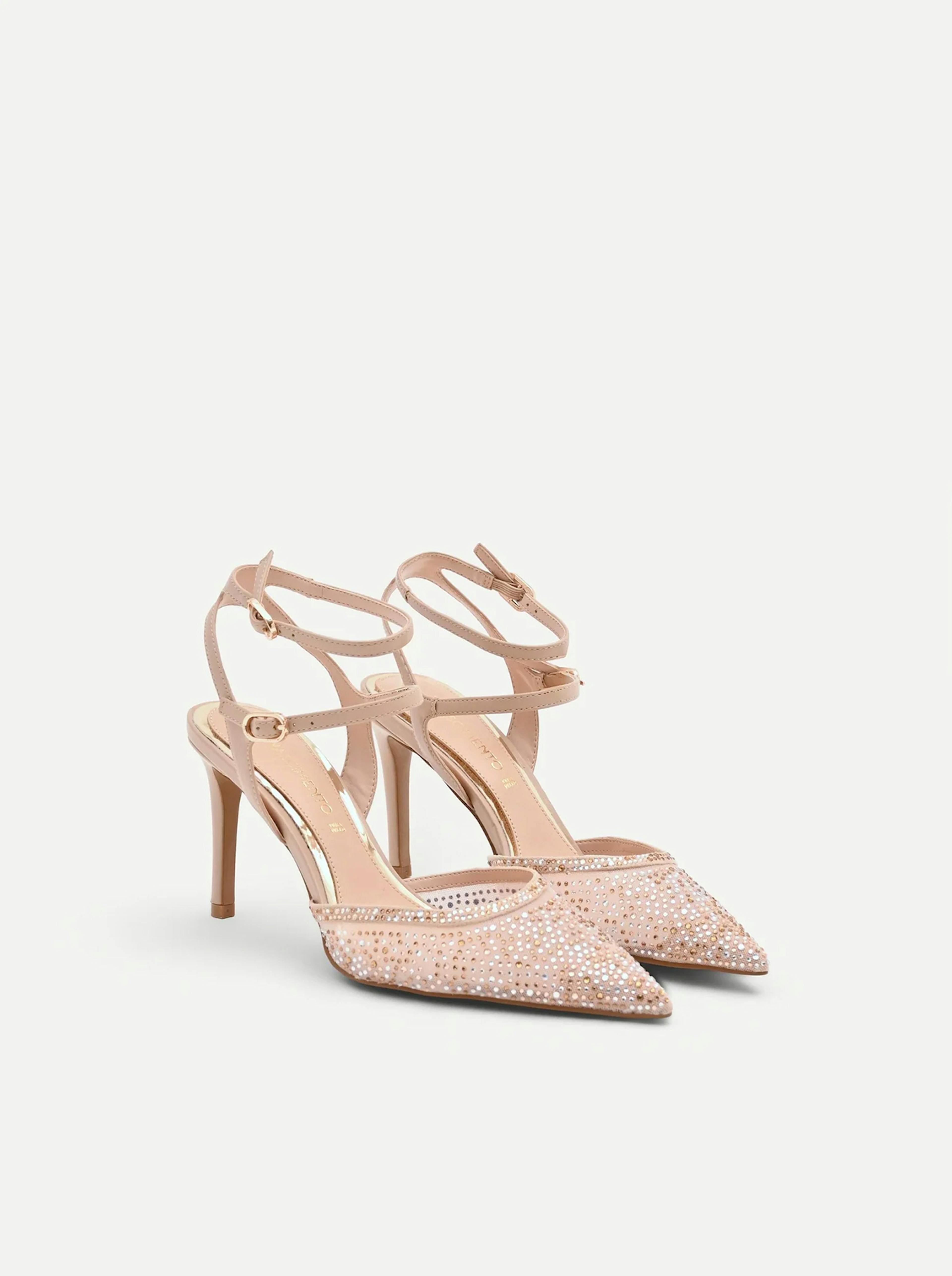 Pink stiletto heels with a pointed toe and sparkling embellished design, featuring multiple ankle straps for elegant support.