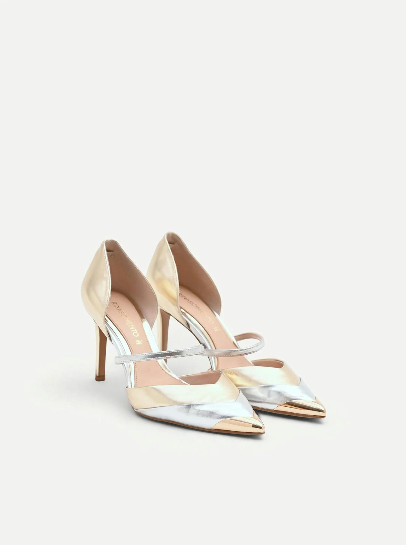Elegant high-heeled shoes featuring a metallic silver and gold design with pointed toes and stylish ankle straps.