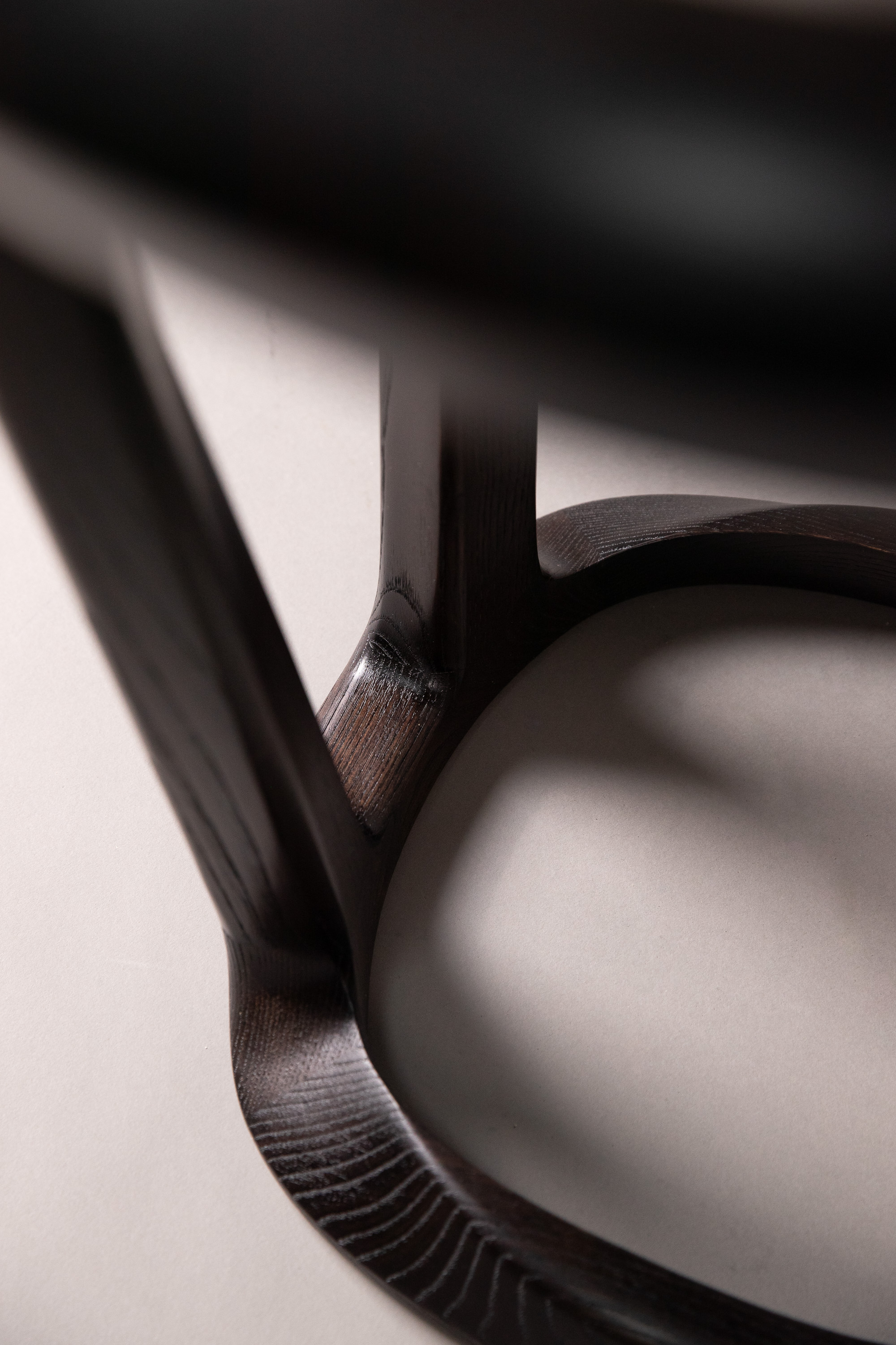 Detail of the side table - structure in satin dark brown chestnut wood ©Gaspard Hermach/RINCK