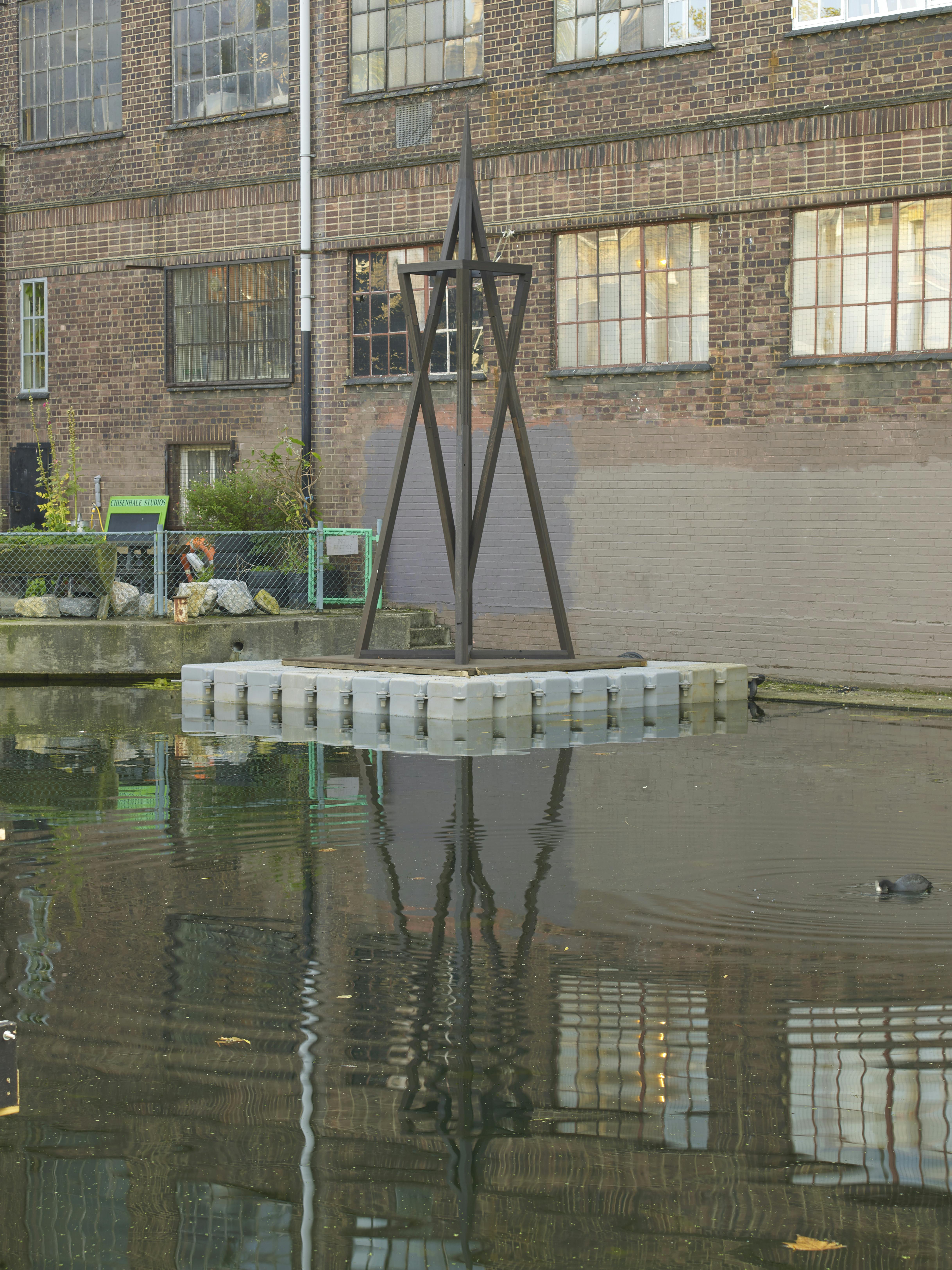 Coeval Proposition #1: Tear down so as to make flat with the Ground or The *Trans America Building DISMANTLE EVERYTHING 2021, Ebonized Redwood Installation view Hertford Union Canal, 2021. Commissioned and produced by Chisenhale Gallery, London and SculptureCenter, New York Photo: Andy Keate.