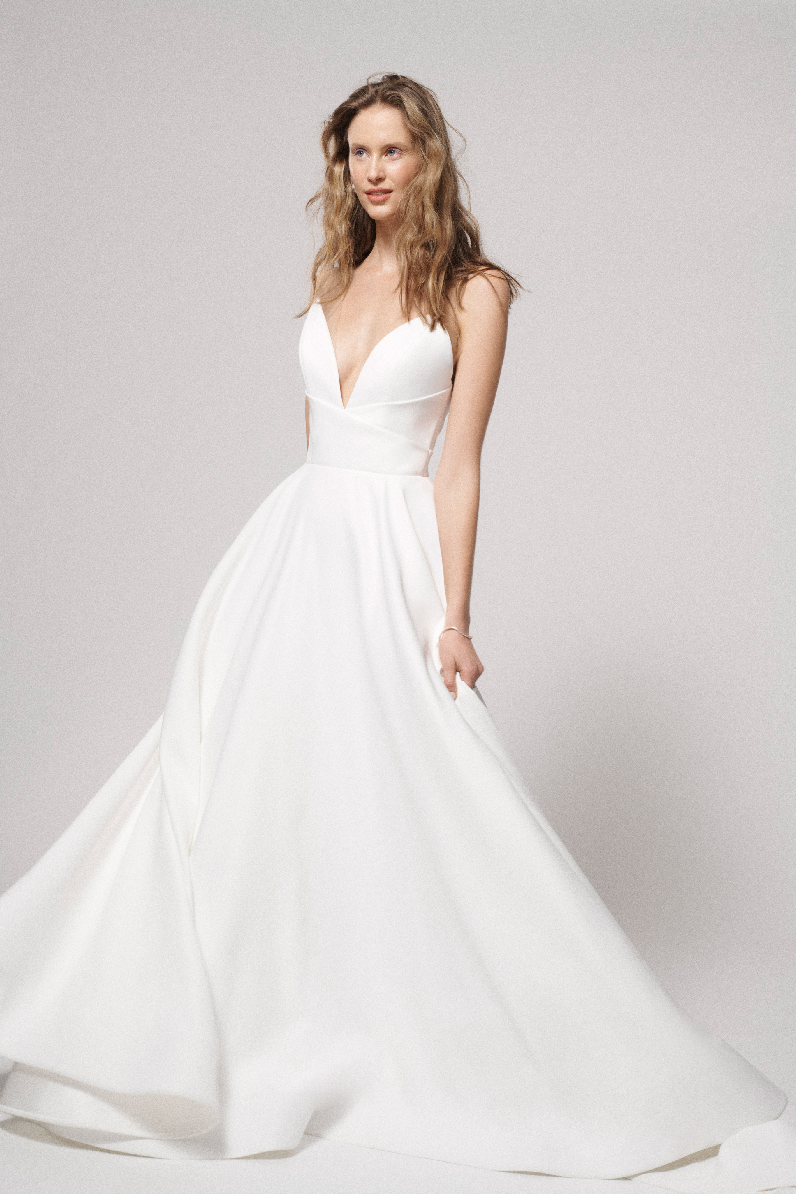 Ali ivory ball gown with modified sweetheart bodice, draped empire waist, and full skirt, shown from the front.