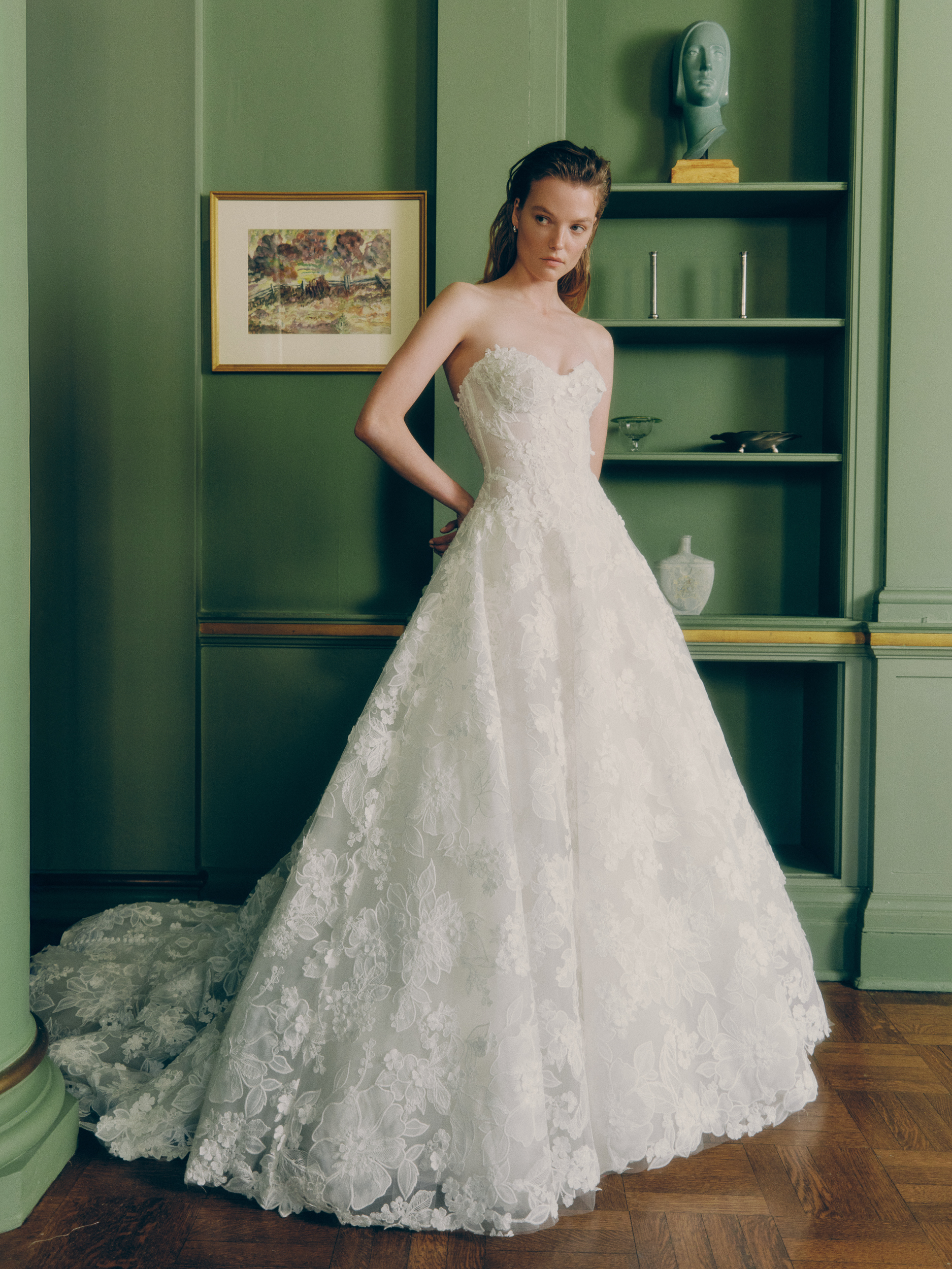 Bride wearing the Lane voluminous ballgown with 3D floral lace, drop-waist corset, and full skirt.
