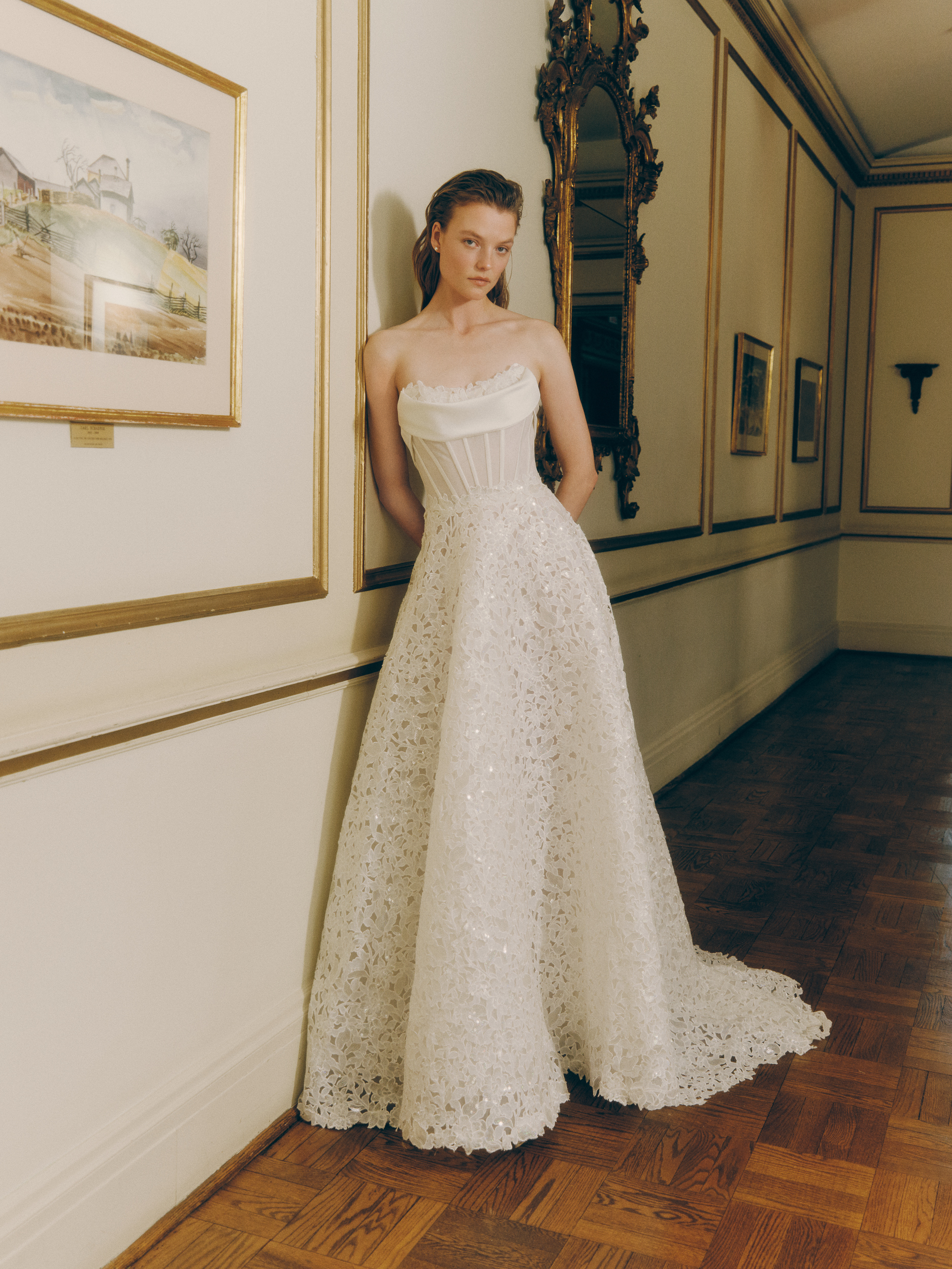 Bride wearing the Beck strapless lace ballgown with a full skirt and softly draped satin detail.