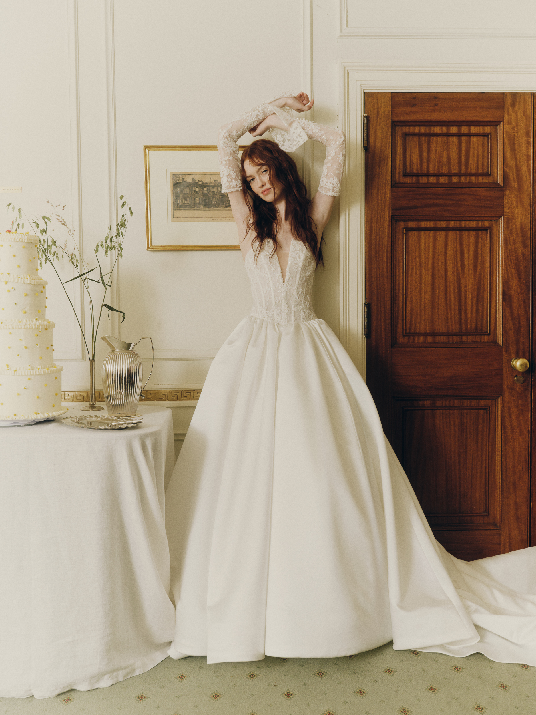 Full-length view of the Mabel strapless ballgown with translucent beaded lace bodice and voluminous satin skirt.