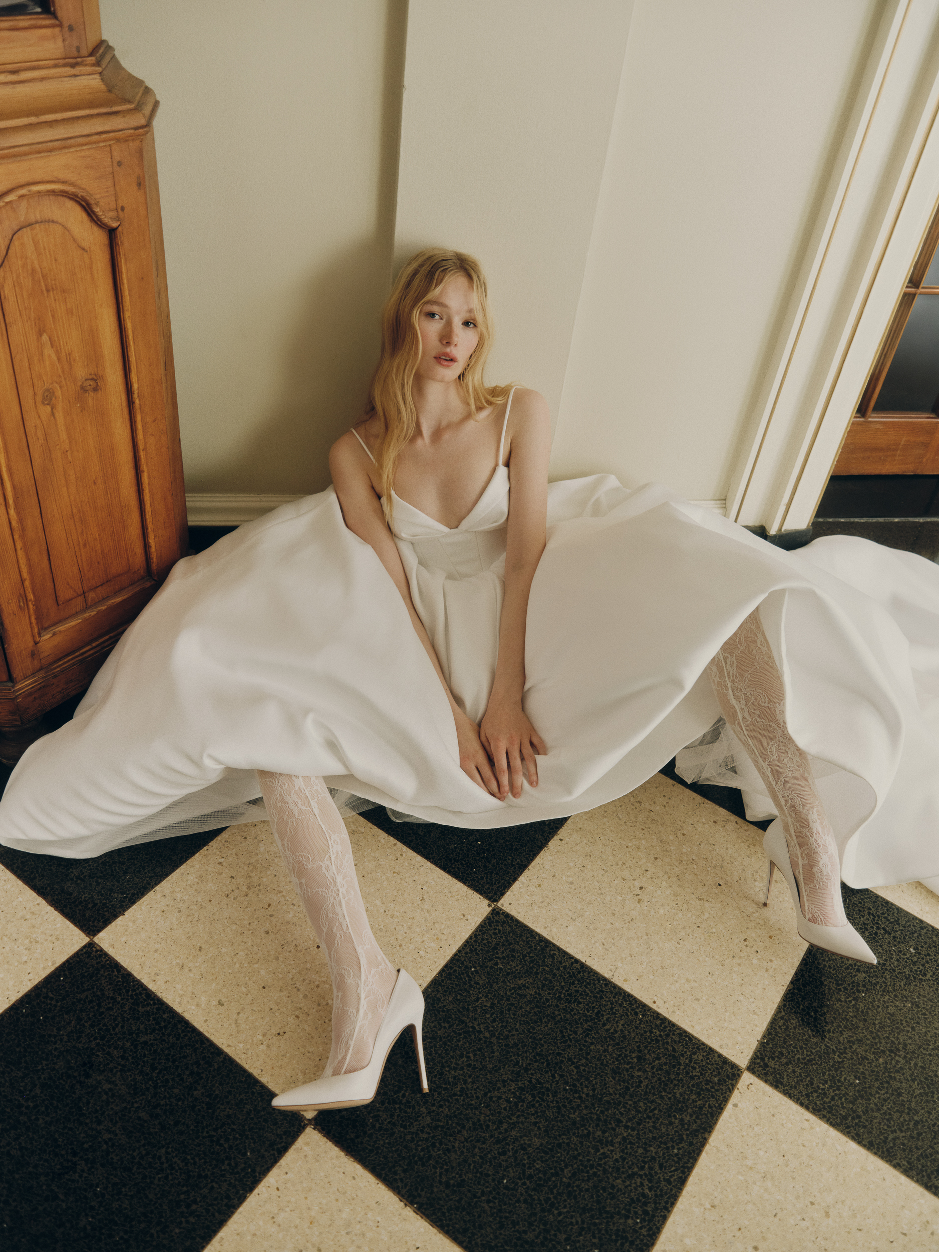 Close-up of the Clovie ballgown, showing the draped ballerina corset, spaghetti straps, and pleated skirt.