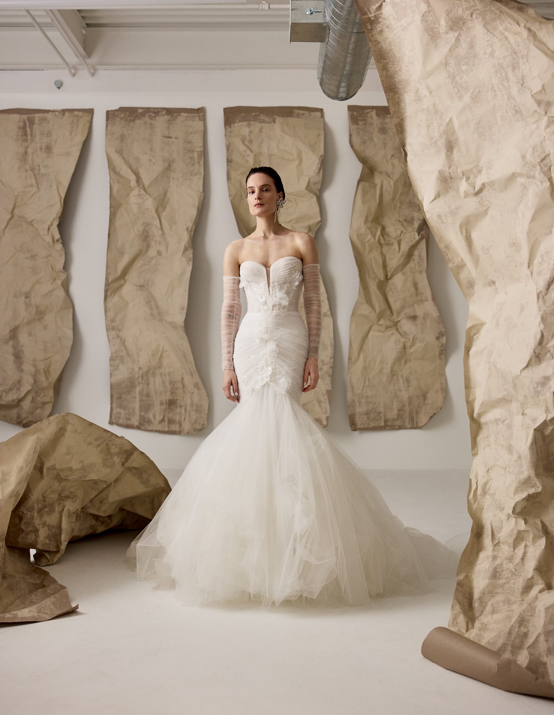 Front view of Billie fit-and-flare gown with draped tulle corset, ruched tulle sleeves, and frothy skirt.