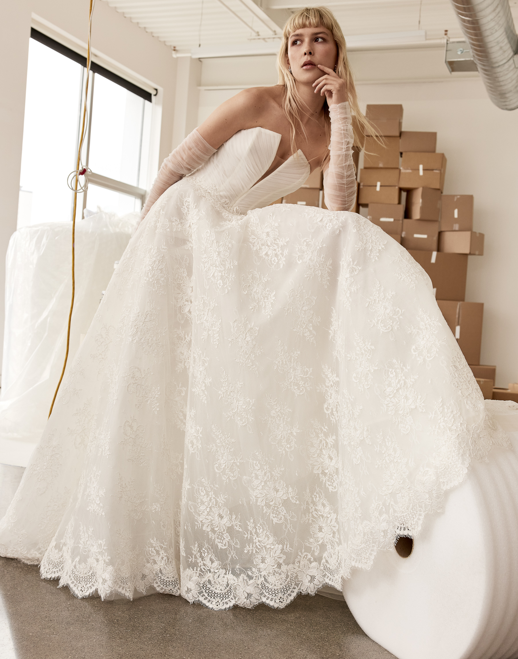 Blake corded lace A-line gown with plunging V-neckline, tulle draped bodice, and full skirt, shown from the front.