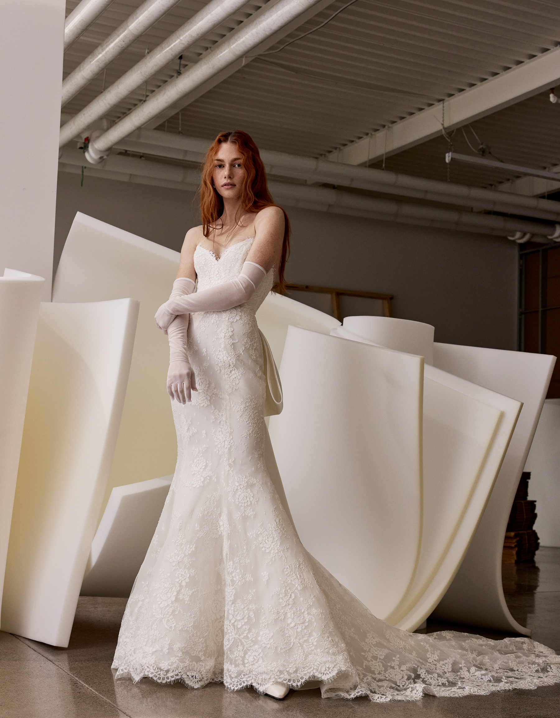 Chiara cat-eye sweetheart fit-and-flare gown with satin bow and tail detail, shown from the front.