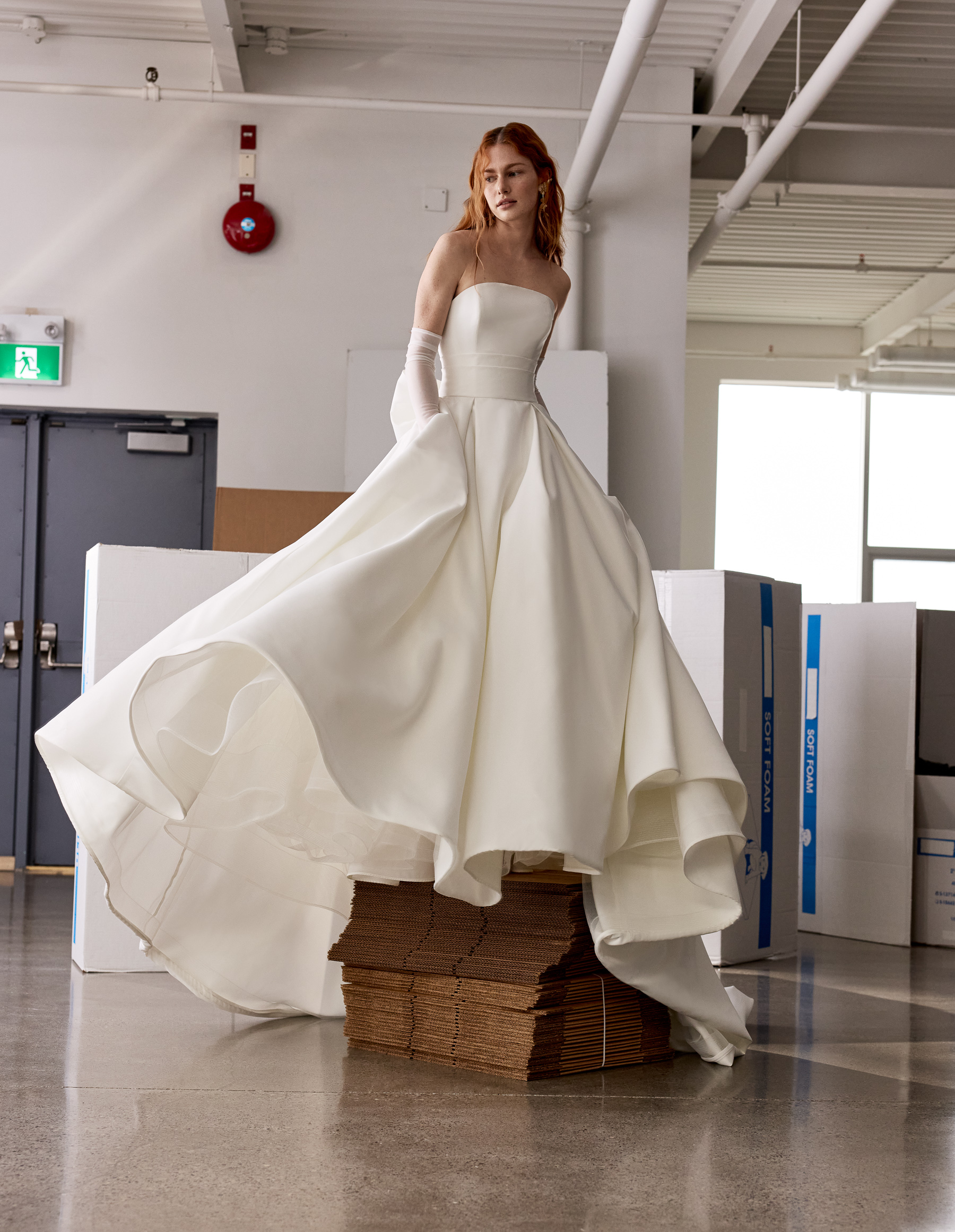 Harley strapless pleated ball gown with draped empire detail, double bow, and full skirt, shown from the front.