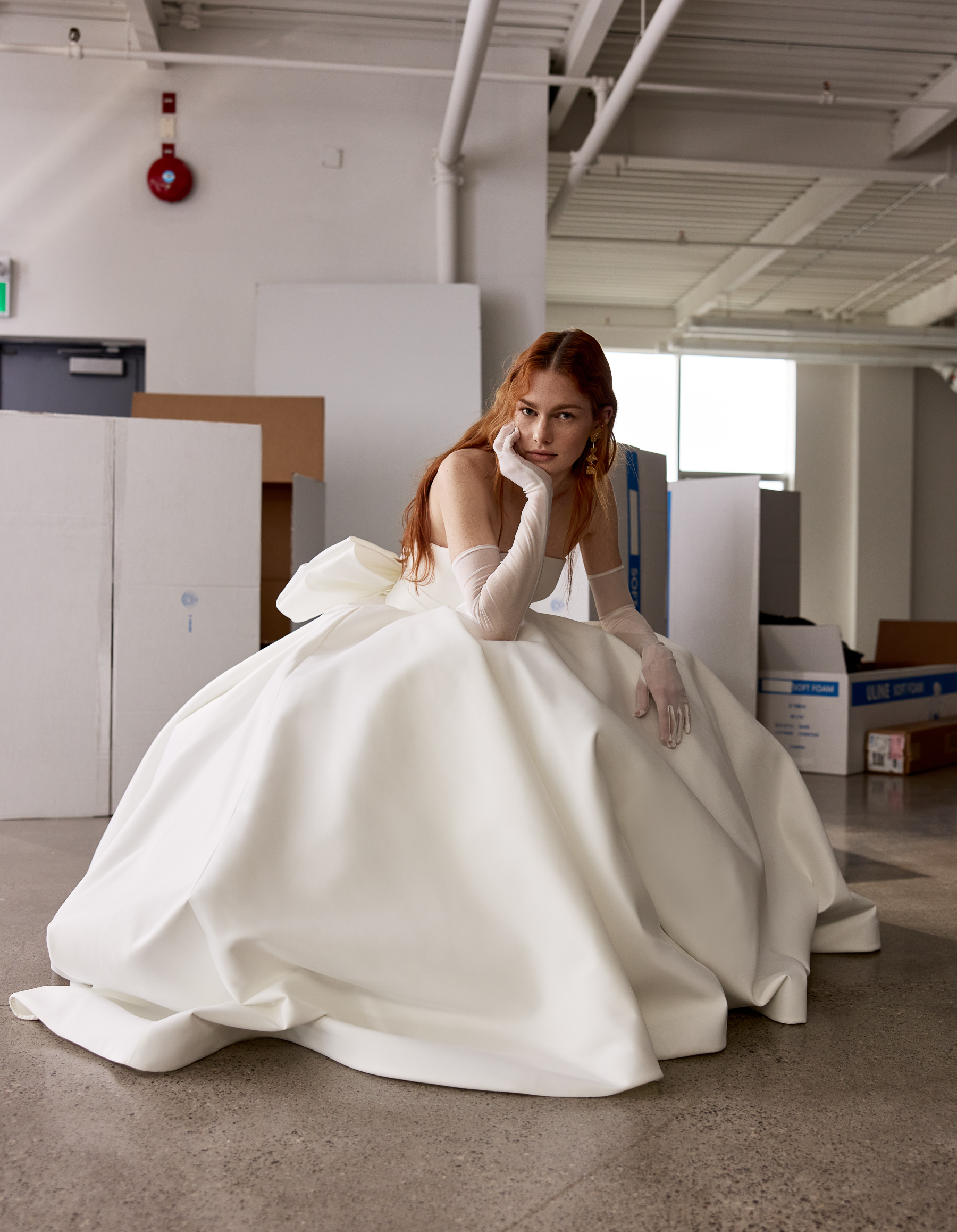 Close-up of Harley gown showing the draped empire detail, double bow, and button-down back.