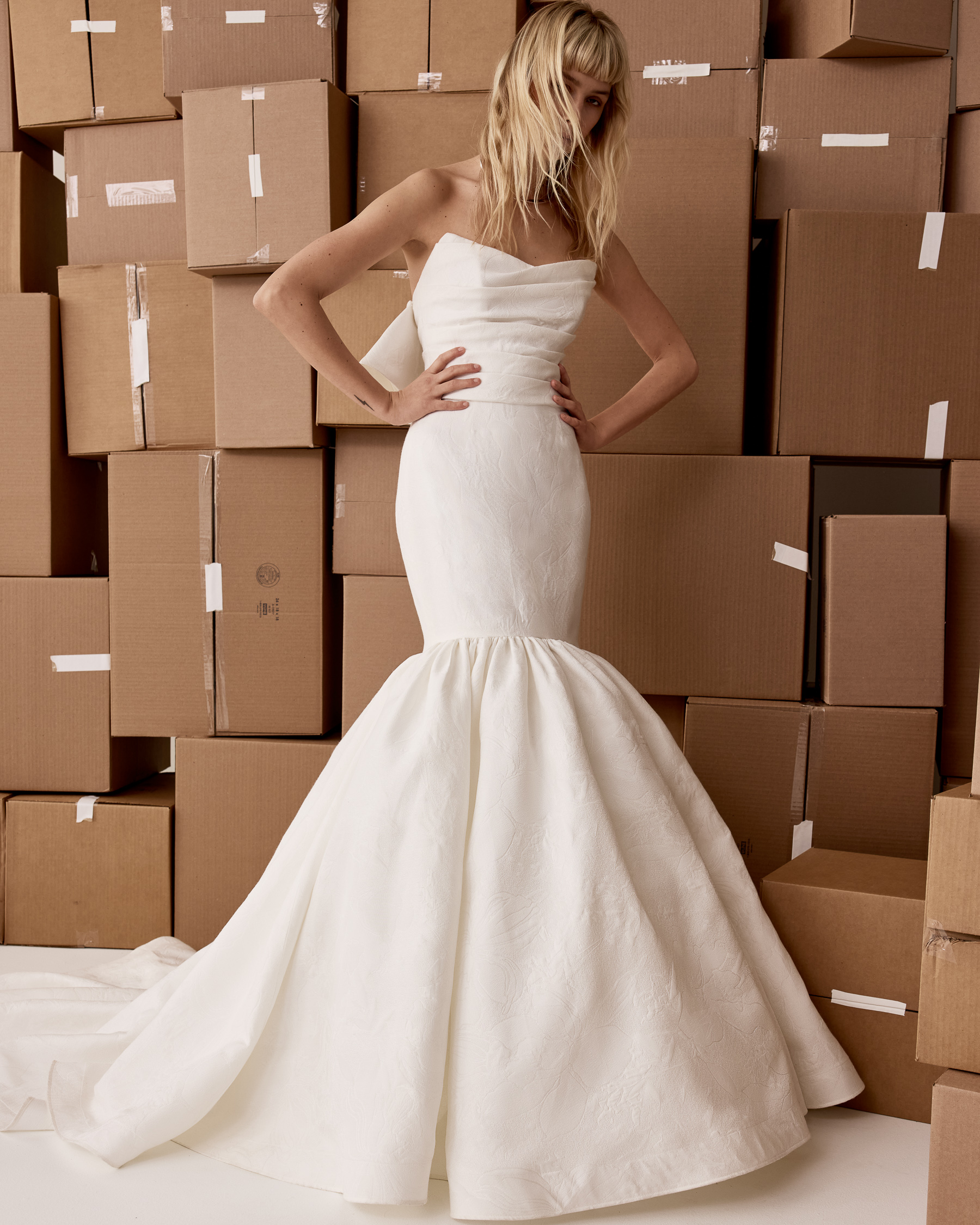 Front view of Sadie strapless matelassé fit-and-flare gown with draped bodice and full skirt.