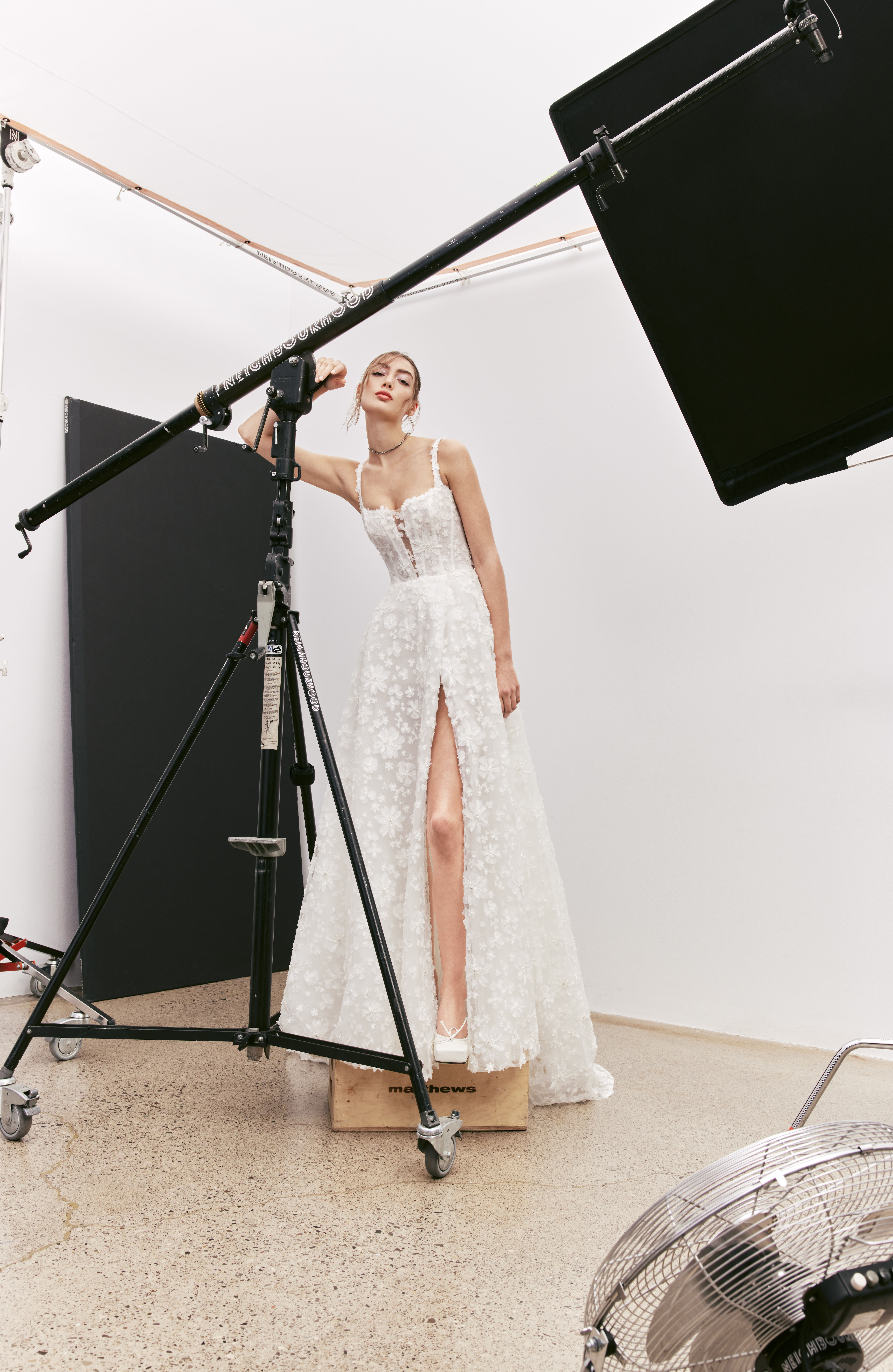 Bella A-line floral lace gown with square deep V neckline, front slit, and boning back detail, shown from the front.