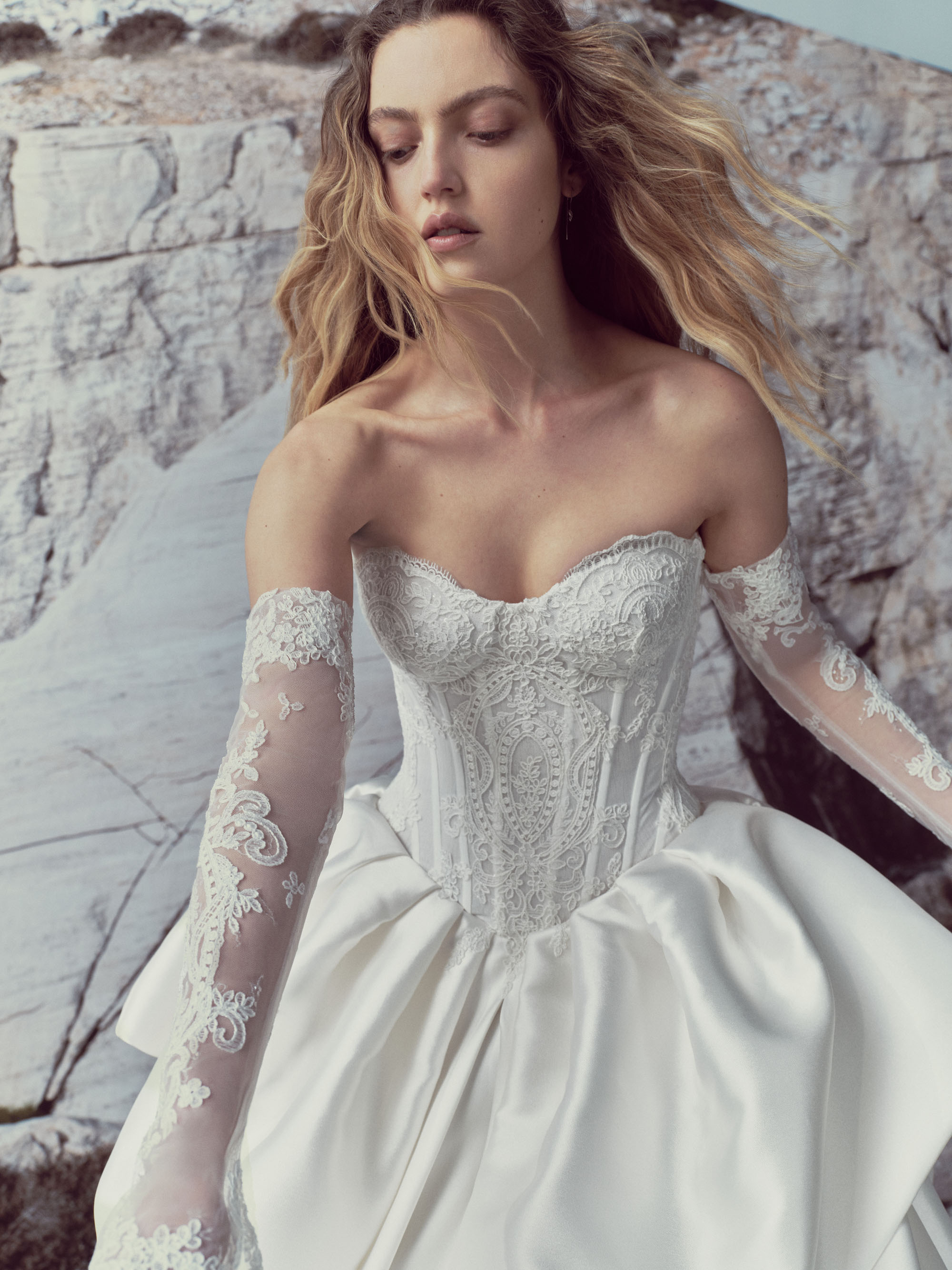 Sonnet RIVINI SS27 ball gown with a translucent basque-waist corset, hand-applied Alençon lace, detachable tulle sleeves, and a grand mikado skirt.
