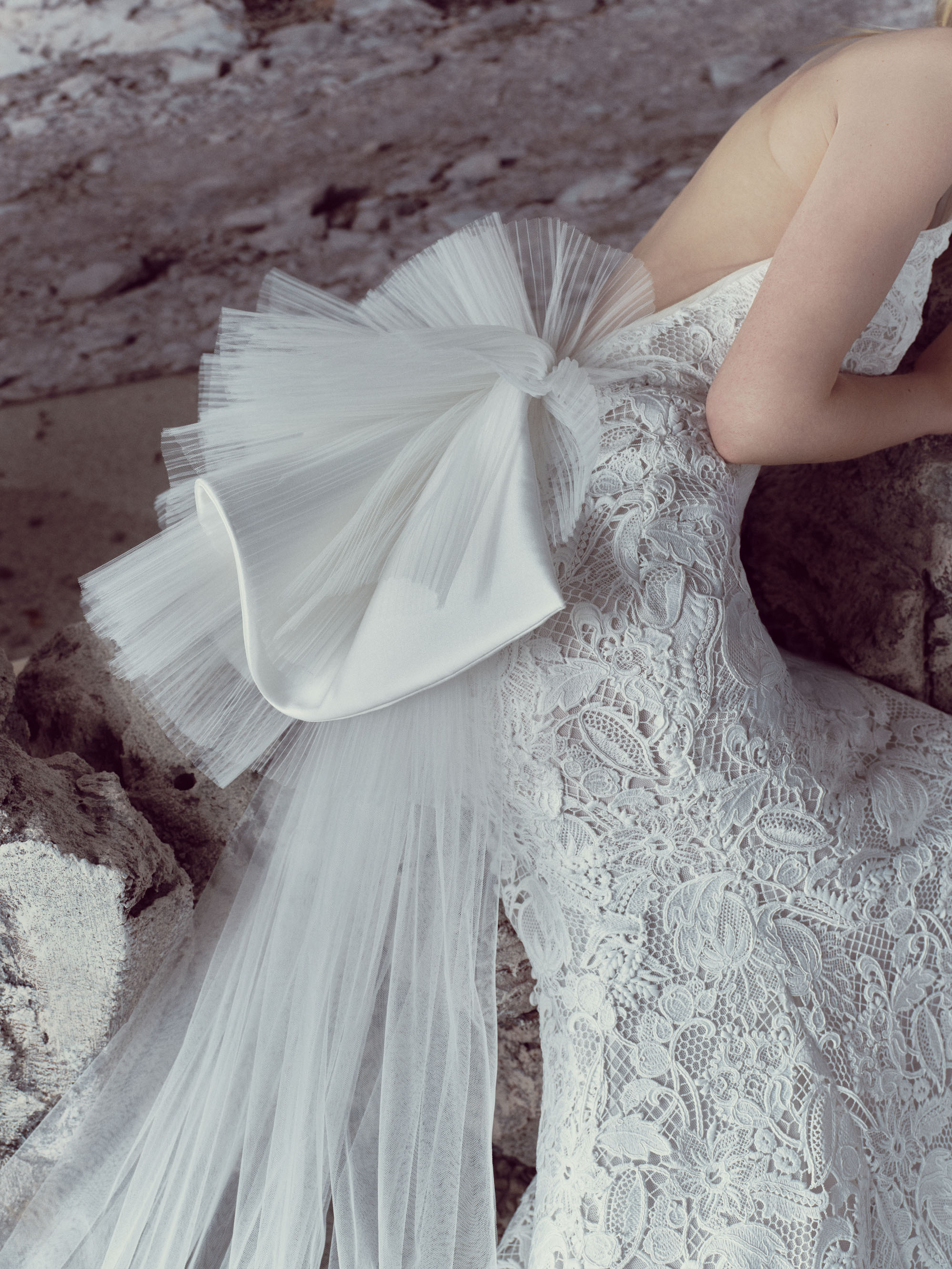 Close-up of Sylvie showing the guipure lace halter bodice and layered silk kalika and micro-pleated tulle ruffles.