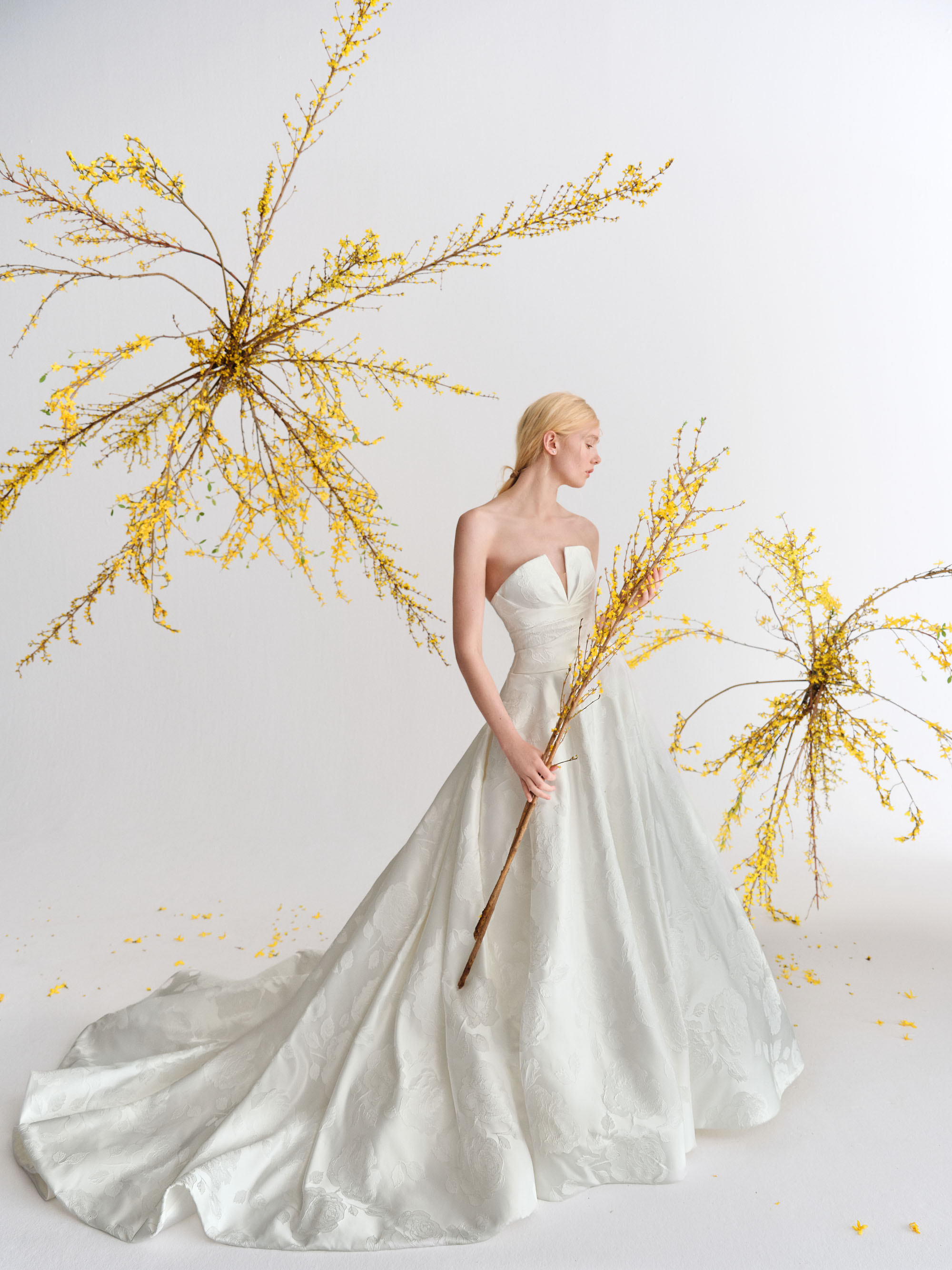 Leni Alyne SS27 jacquard ball gown with a draped V-notch bodice, softly voluminous skirt, and sweeping cathedral train.