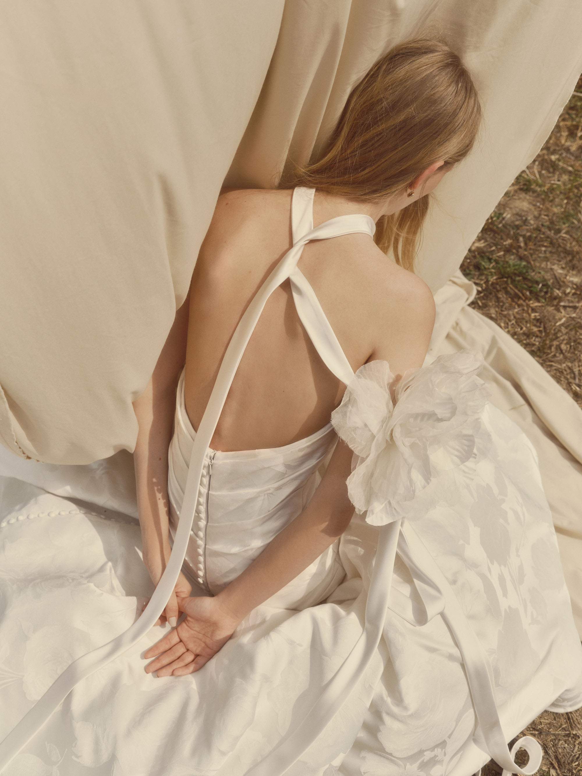 Close-up of Glissade showing the fitted jacquard bodice, ruched waist, and flowing skirt.