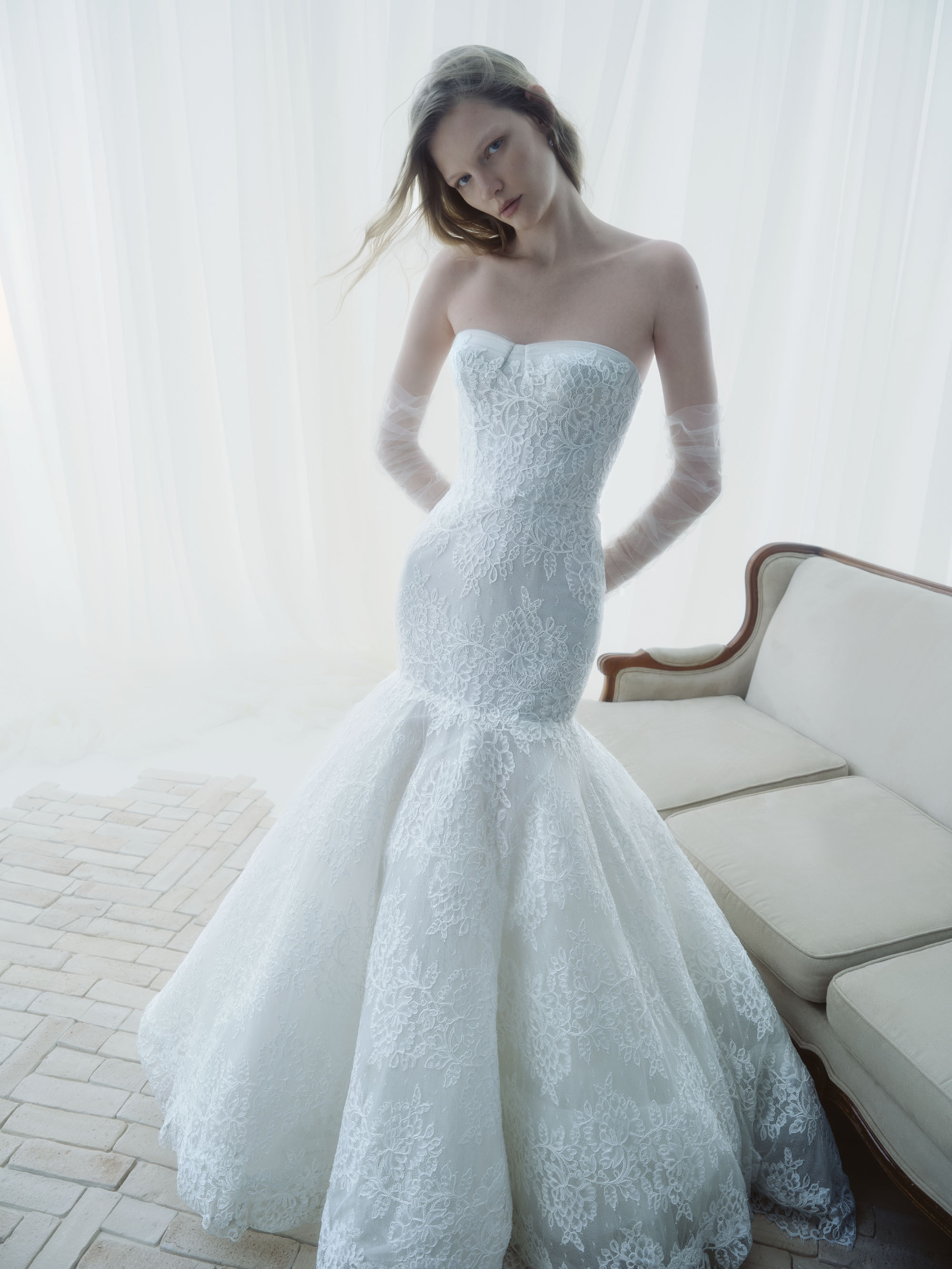 Full view of Horizon showing the fitted strapless bodice and softly flared Chantilly lace skirt.