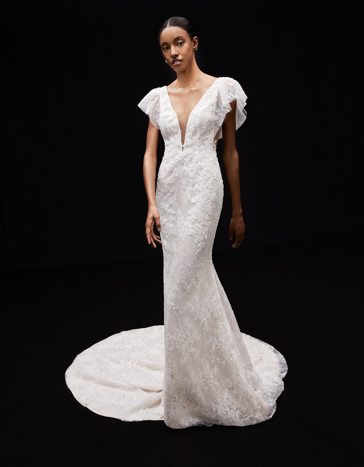 Juliette ivory embroidered shimmer lace sheath gown with deep V neckline and flutter sleeves, shown from the front.