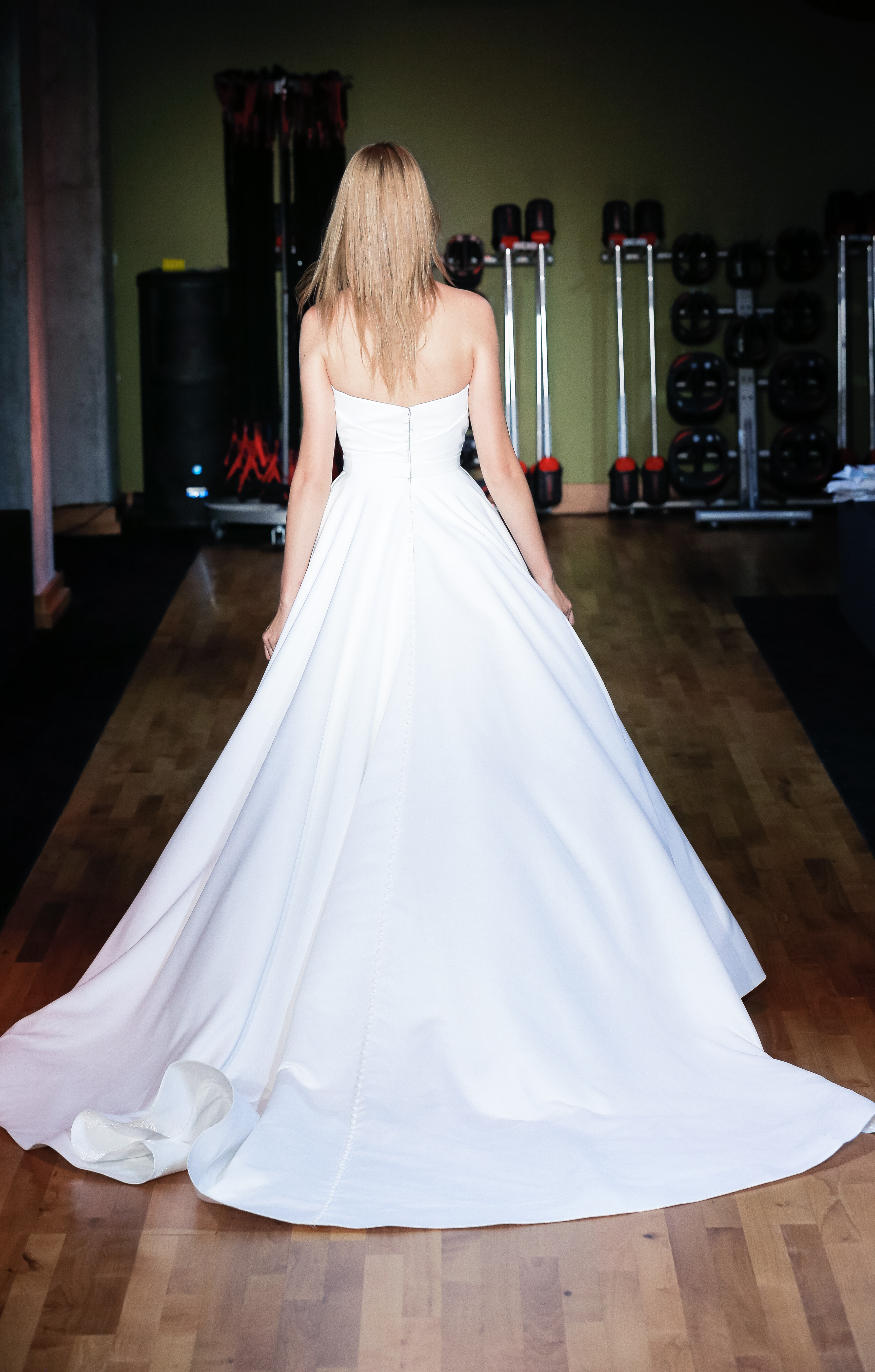 Back view of Camila matte satin ball gown with full skirt and structured bodice.
