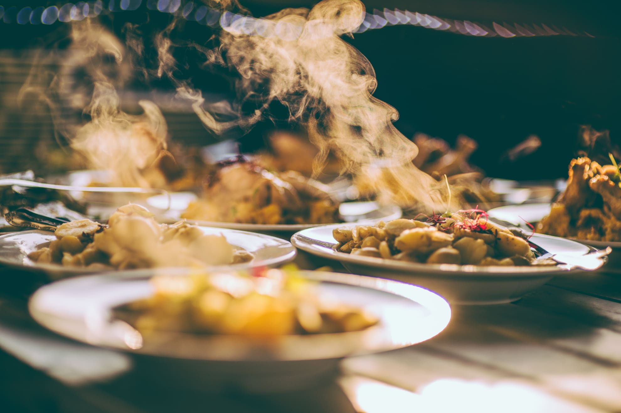 A table filled with bowls of steaming food on the River Exe Café