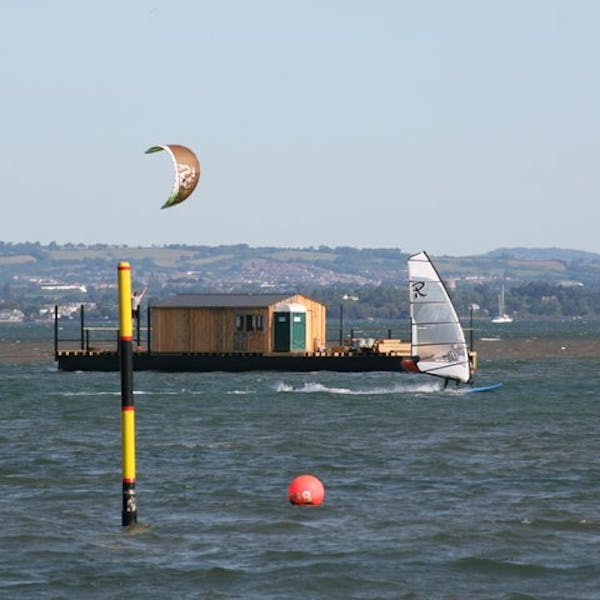 The café moored in the estuary in its final place with work continuing