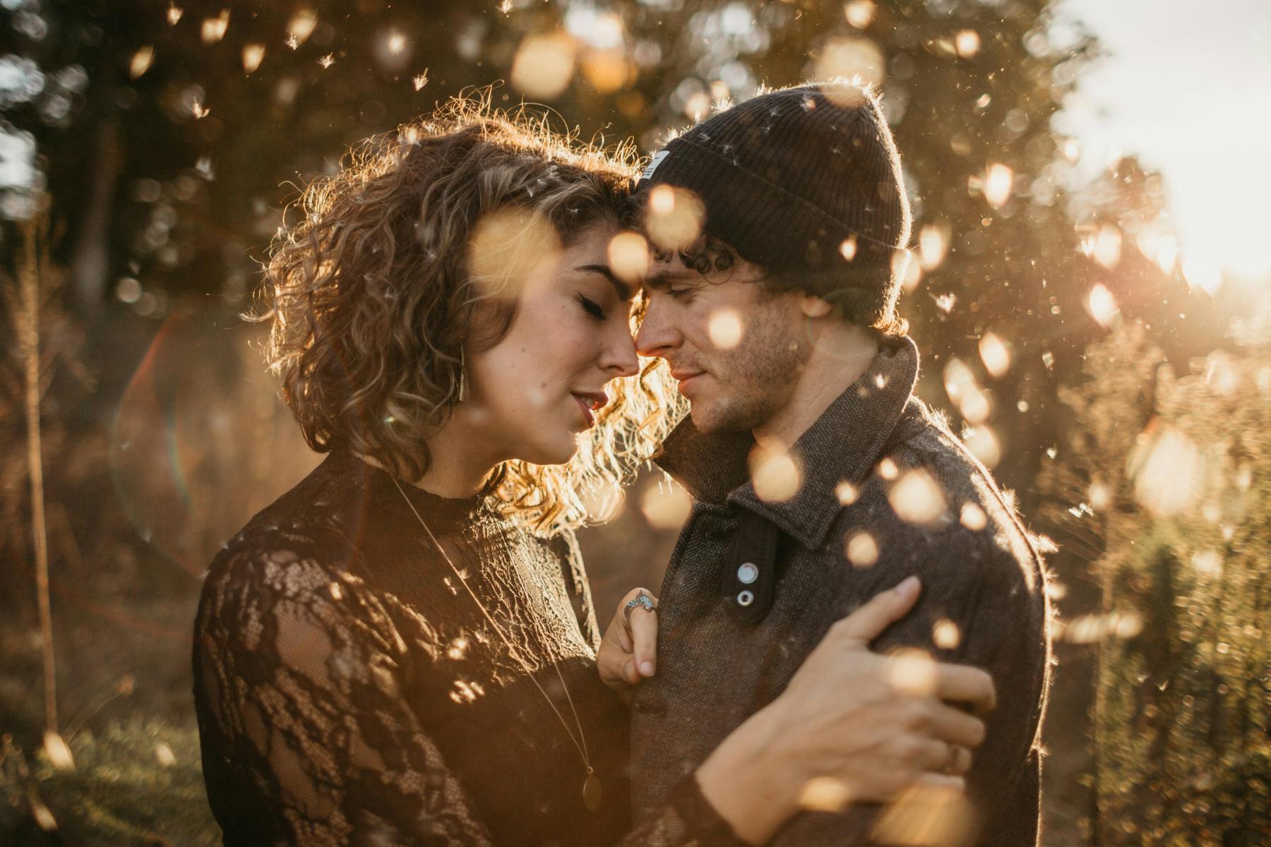 Husband and wife embrace in the autumn air