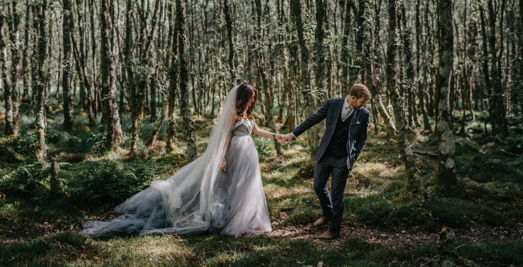 Couple in the forest of Glendalough, Ireland