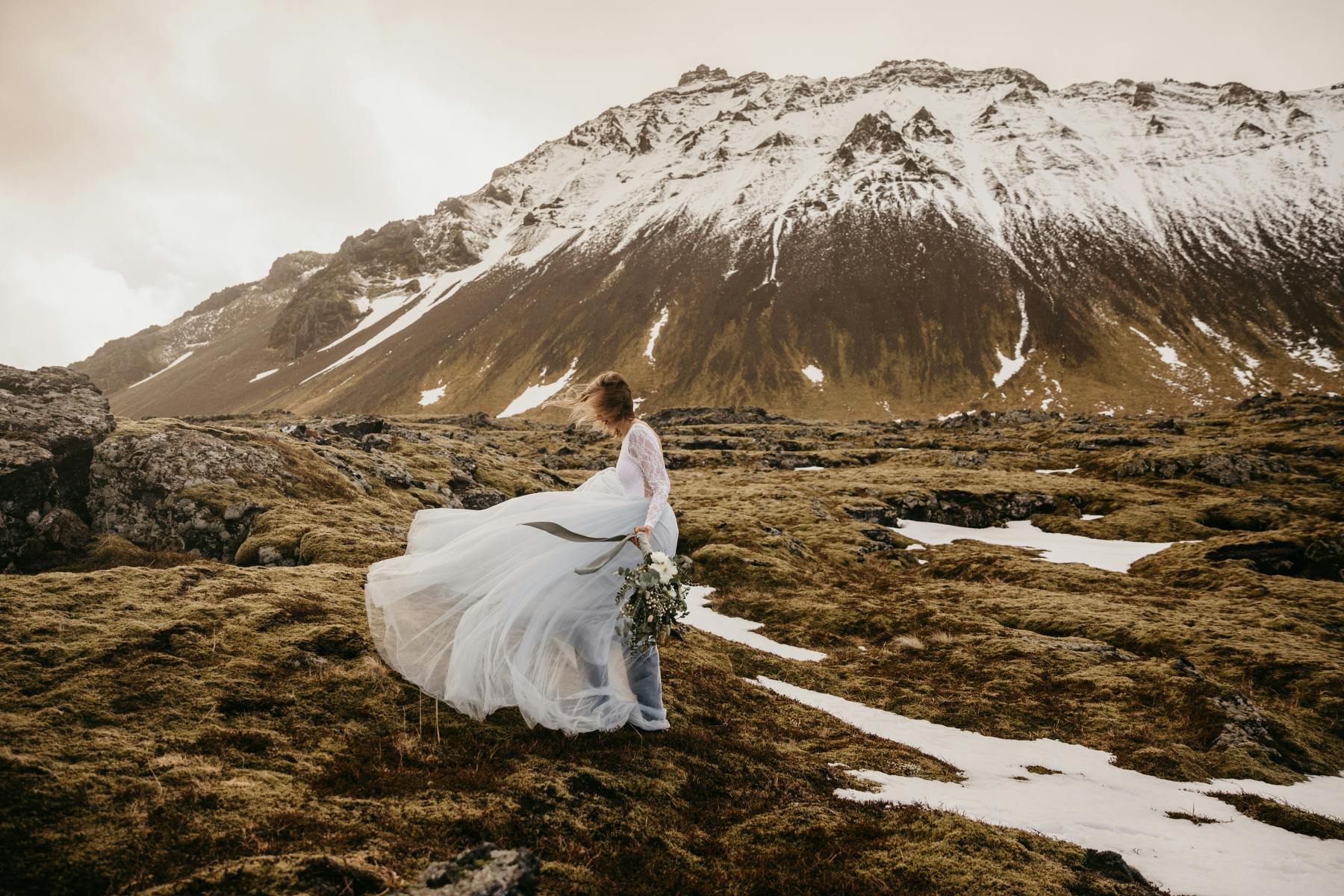 Bride in front of Icelandic mountain