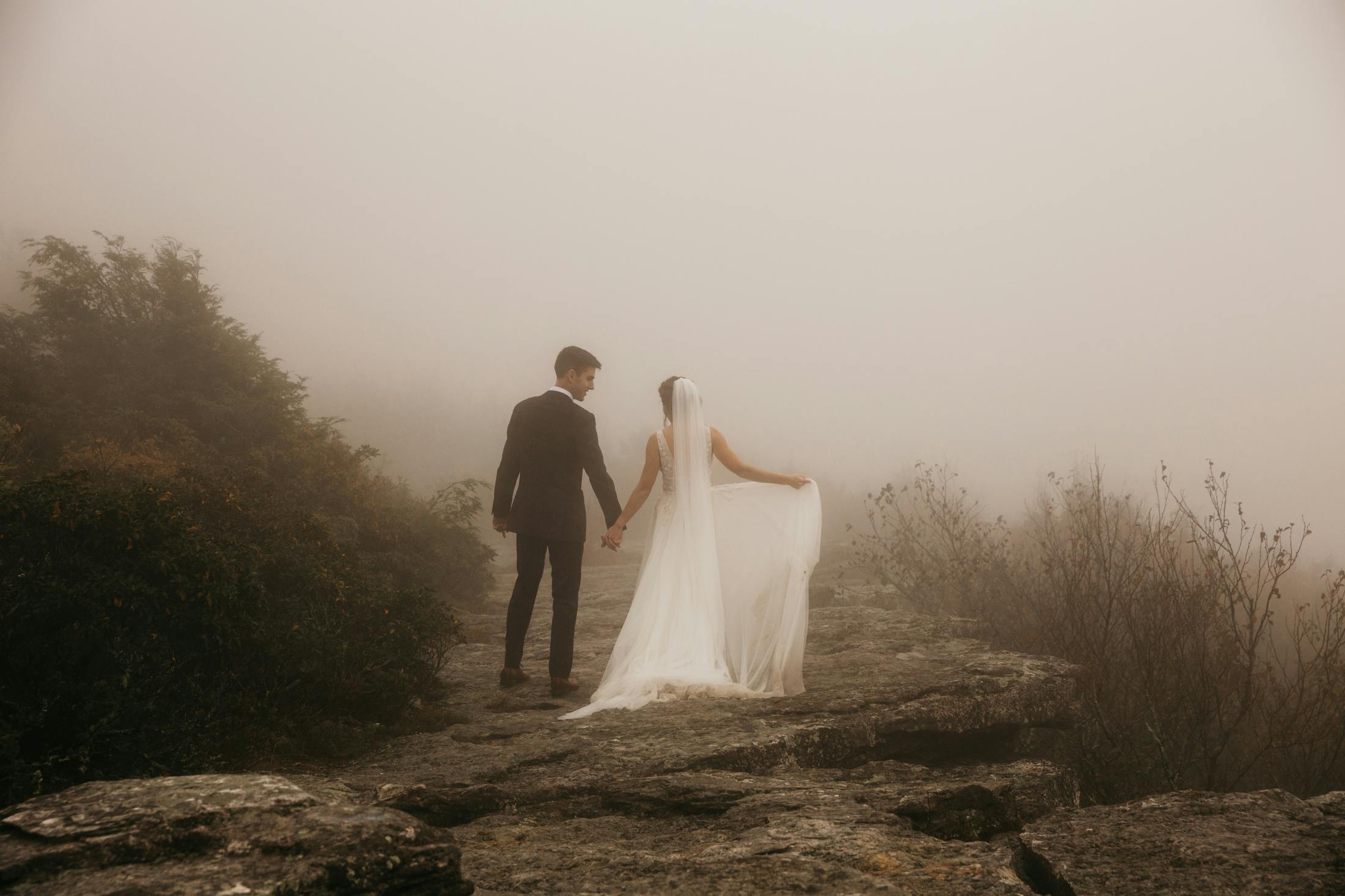 Bride and groom in the fog