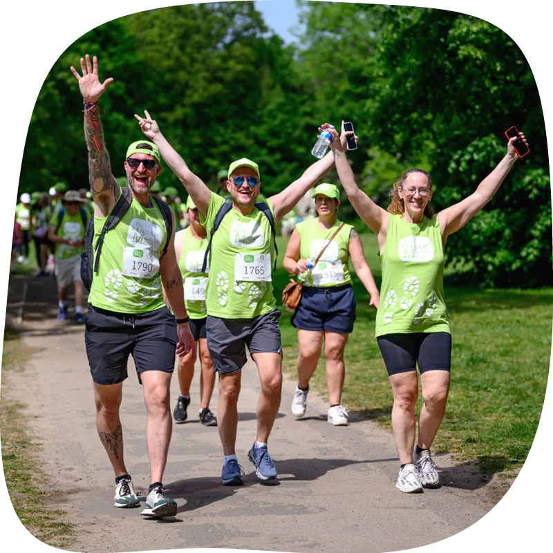 Marsden March participants waving and smiling.