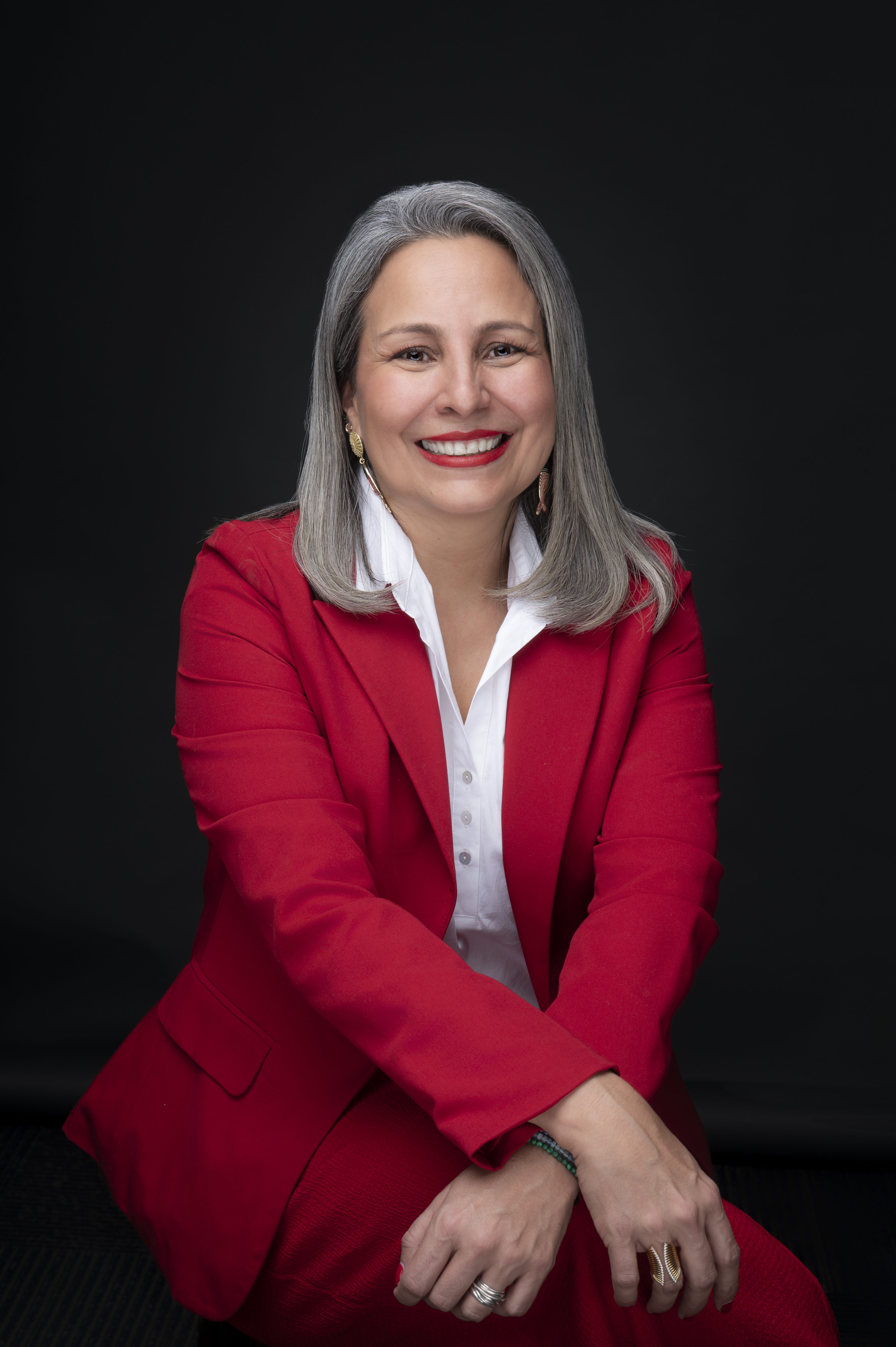 Portrait of the women in red suit smiling