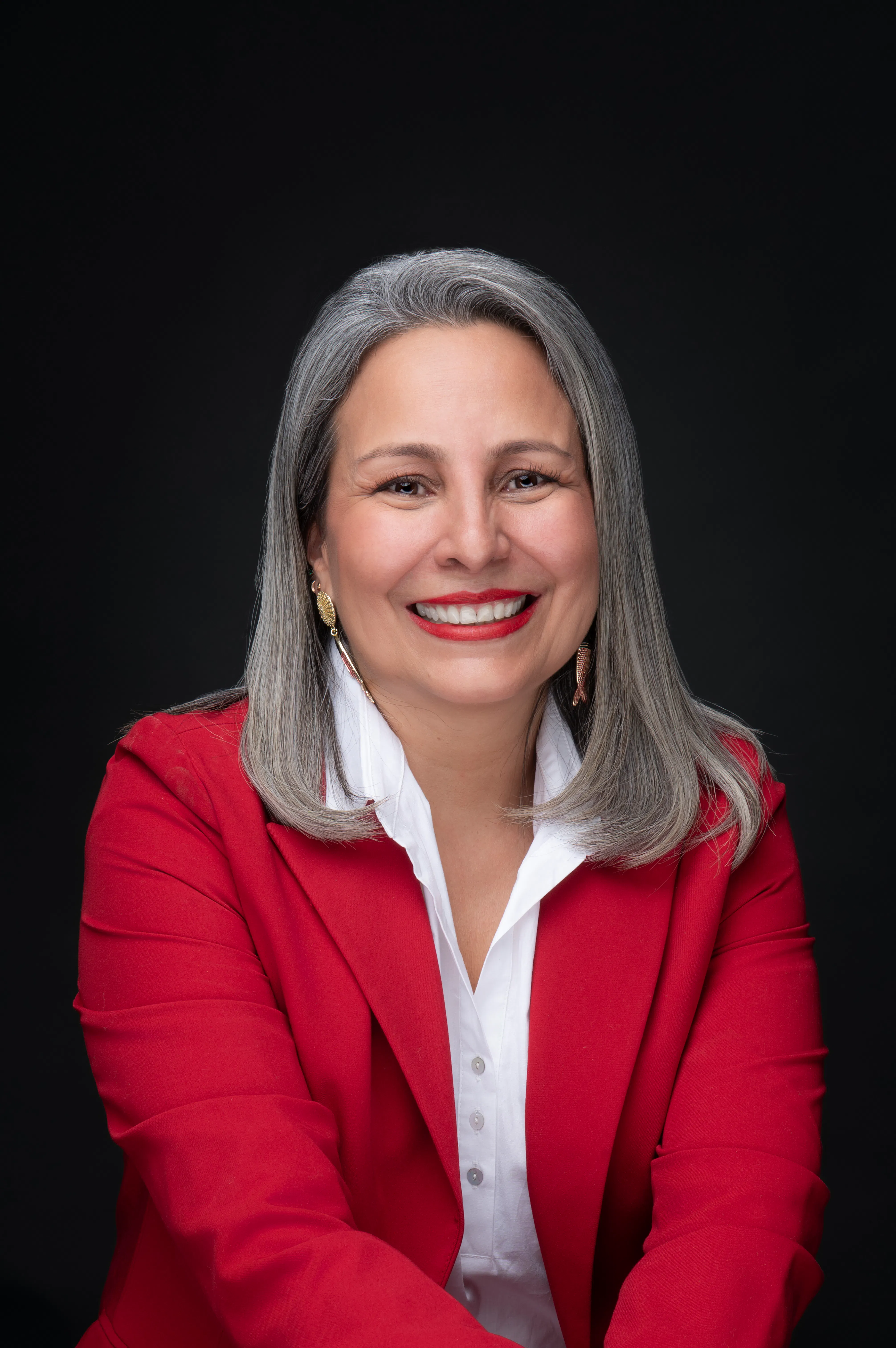 Portrait of the women in red suit smiling