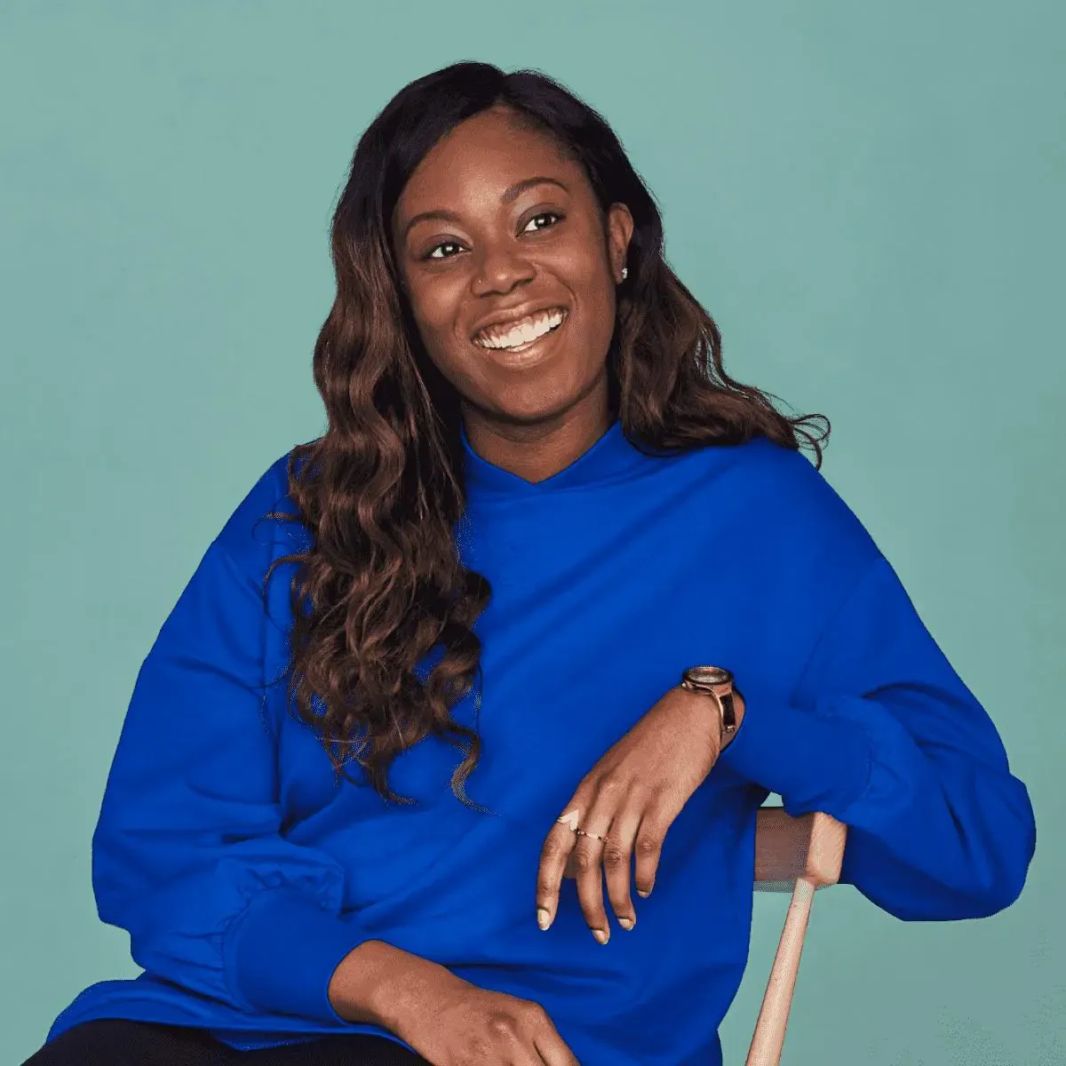 women sitting on the chair smiling