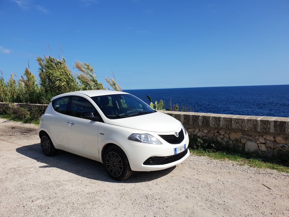 Rent a car in Italy whether you’re 18, 25 or 80, like this white hatchback 