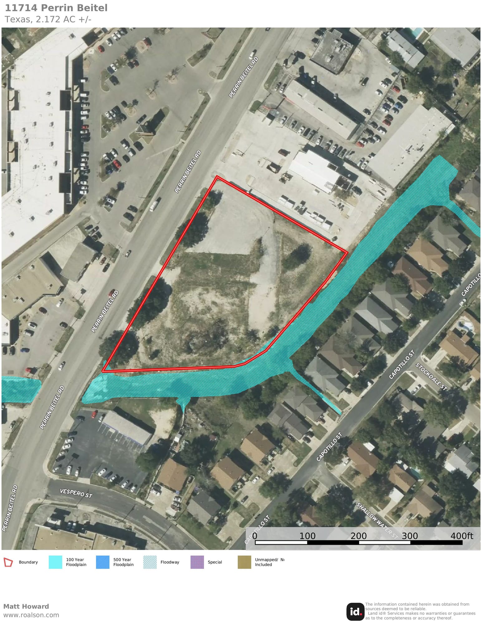 Aerial view of a cleared lot on Perrin Beitel Road outlined in red, with the mapped floodplain shaded along its eastern edge