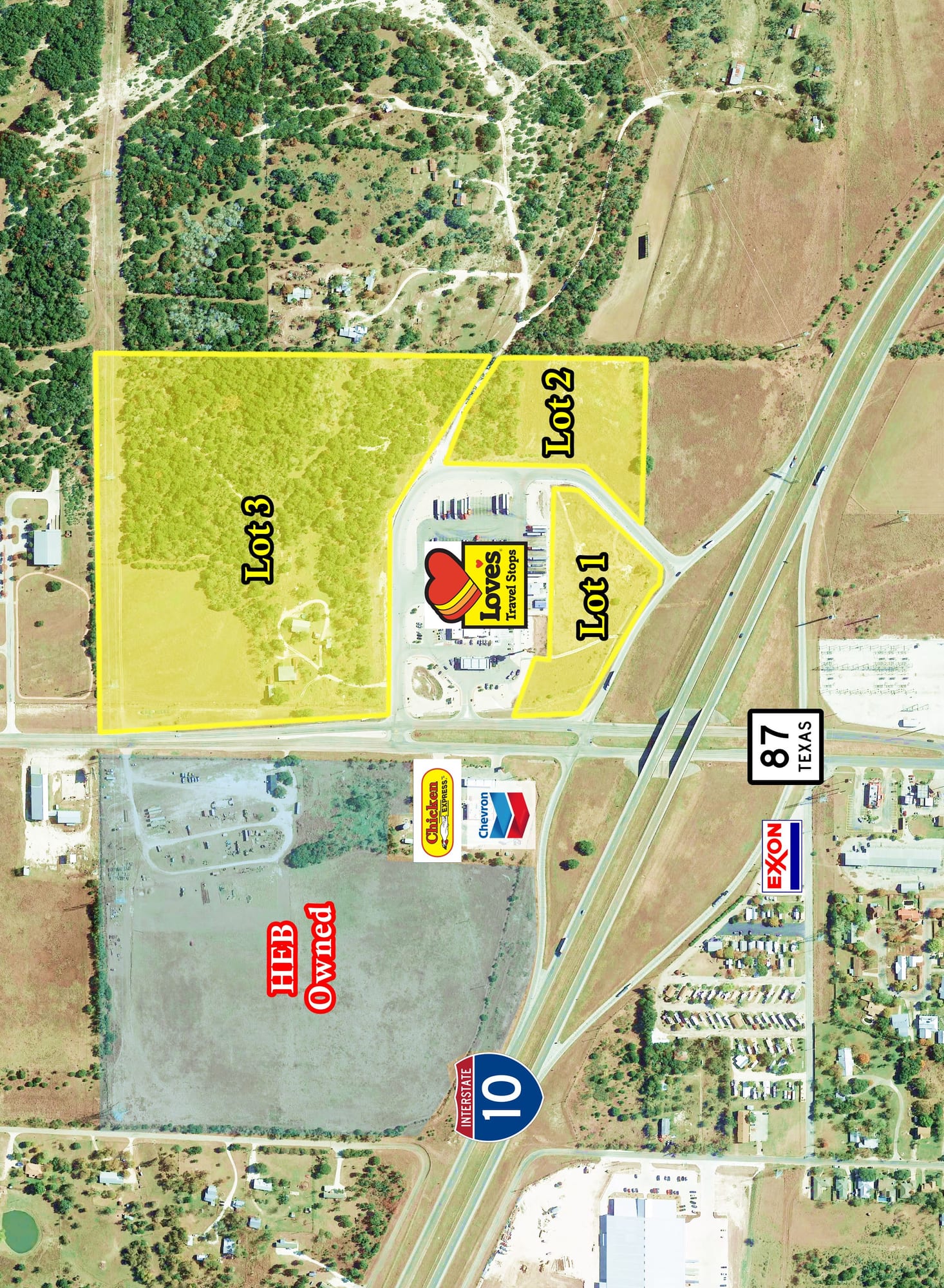 Aerial view of three lots shaded yellow around a travel stop at Interstate 10 and Highway 87 in Comfort