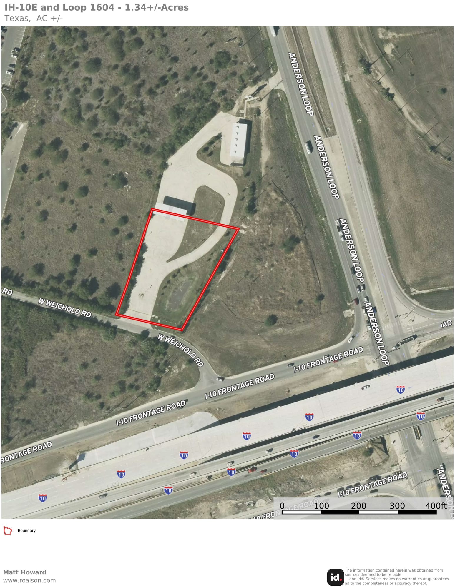 Aerial view of a paved pad site outlined in red on West Weichold Road, off the Interstate 10 frontage at Loop 1604