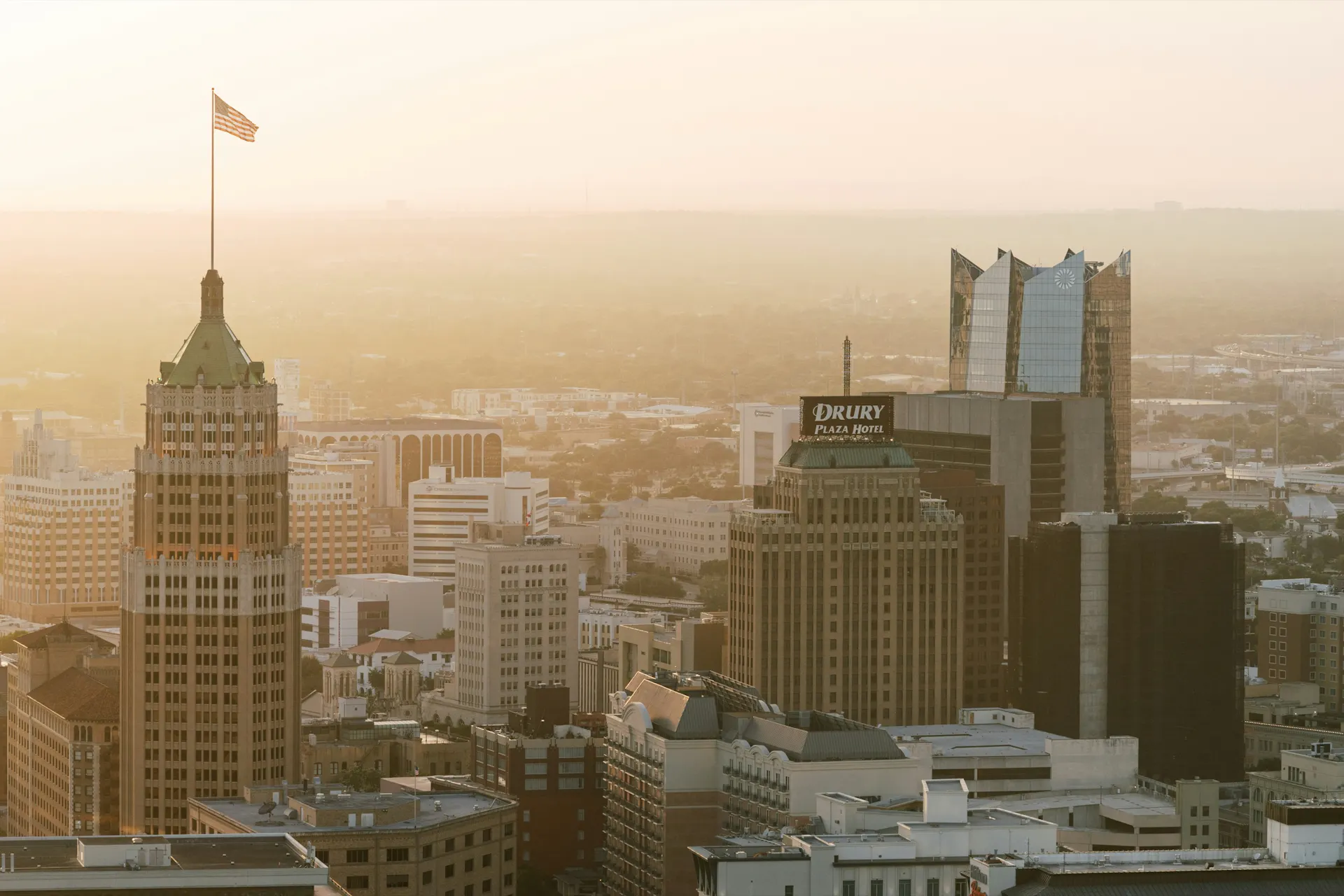Downtown San Antonio at golden hour, the Tower Life Building in the foreground