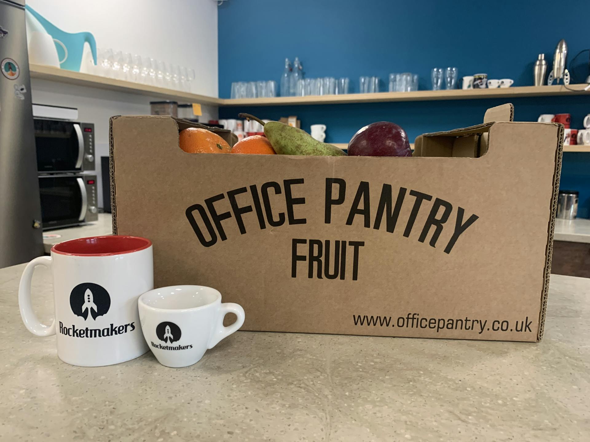 office pantry box with mugs infront of it