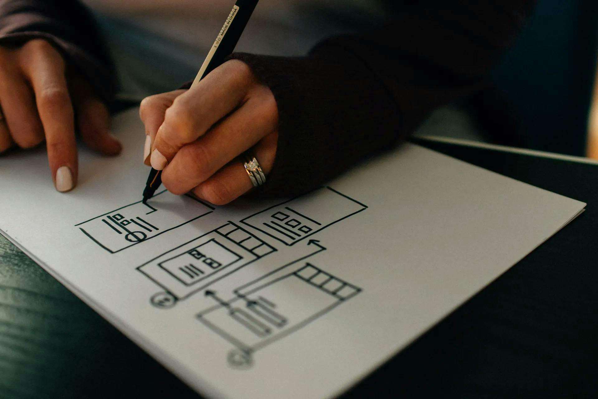 Woman drawing a technical diagram