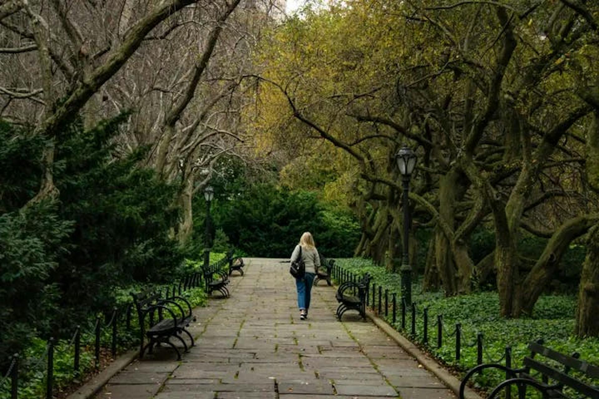Woman walks through park