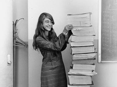Margaret Hamilton Stands Next to Her Code That Took Us to the Moon (1969)