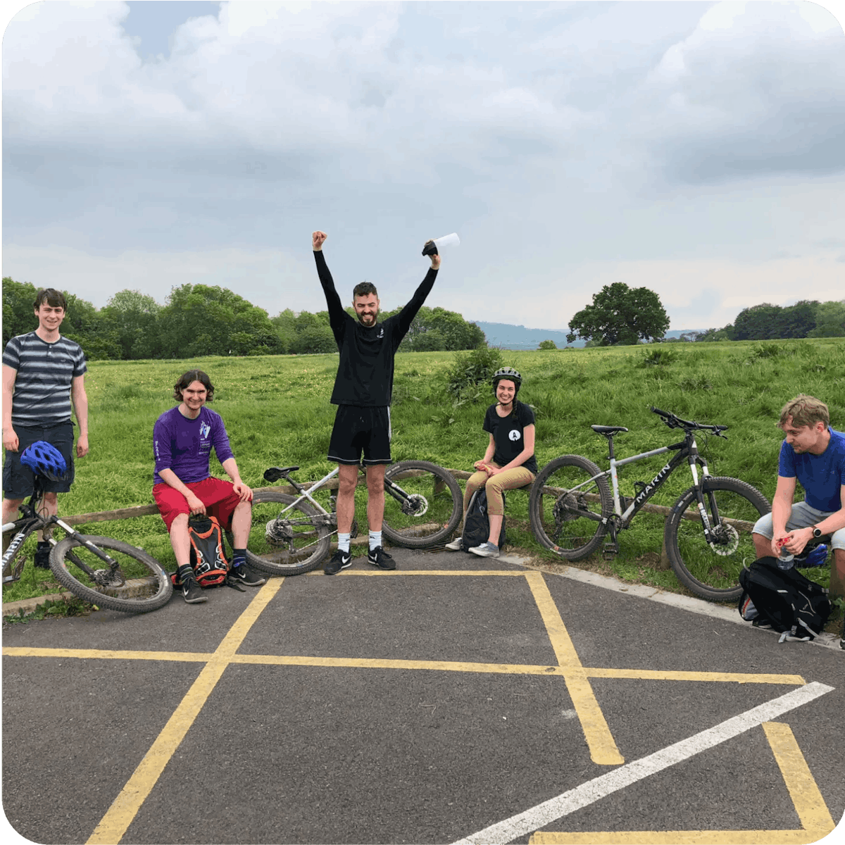 Photo of 5 Rocketmakers team members out in a field with their bicycles.