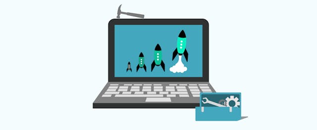 a laptop screen showing different sized rockets and a toolbox next to it